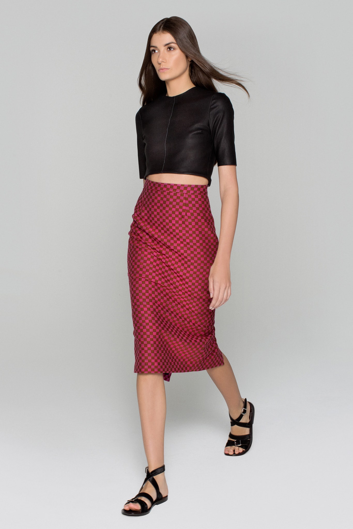 black leather cropped top and red midi skirt