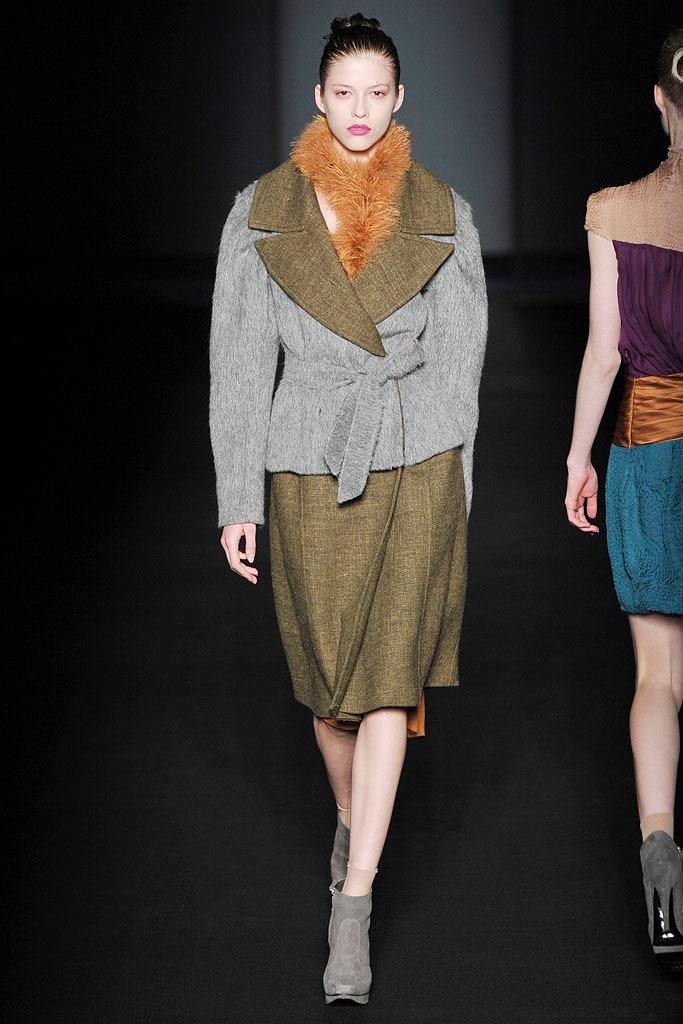 gray wool coat with orange scarf