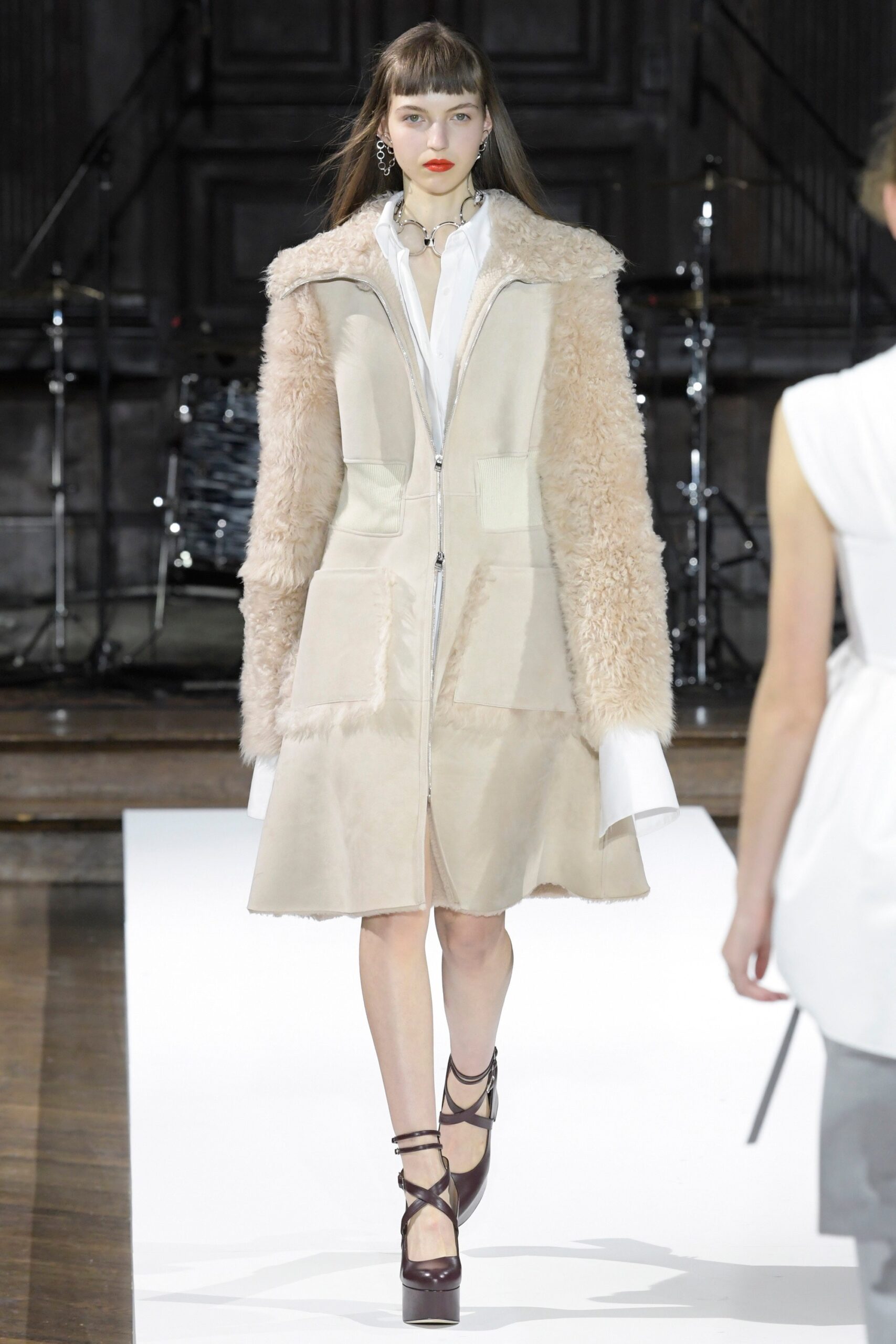 beige fur leather coat and white shirt