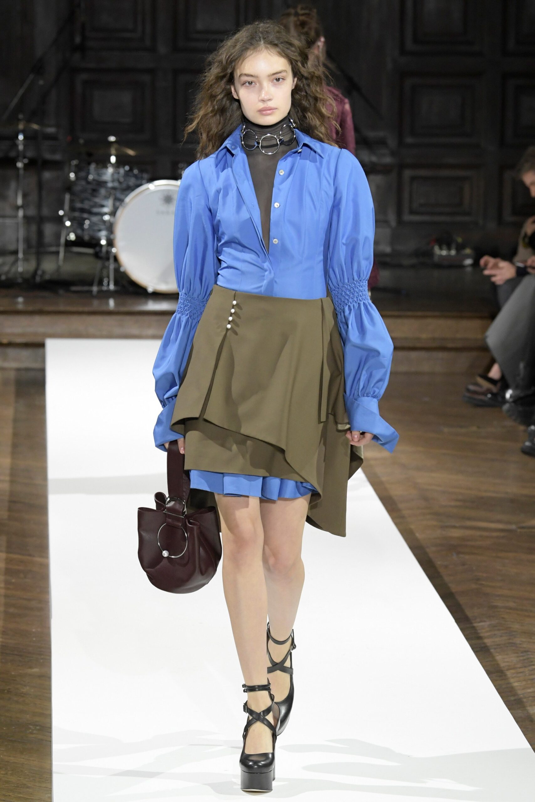 blue shirt green asymmetric skirt