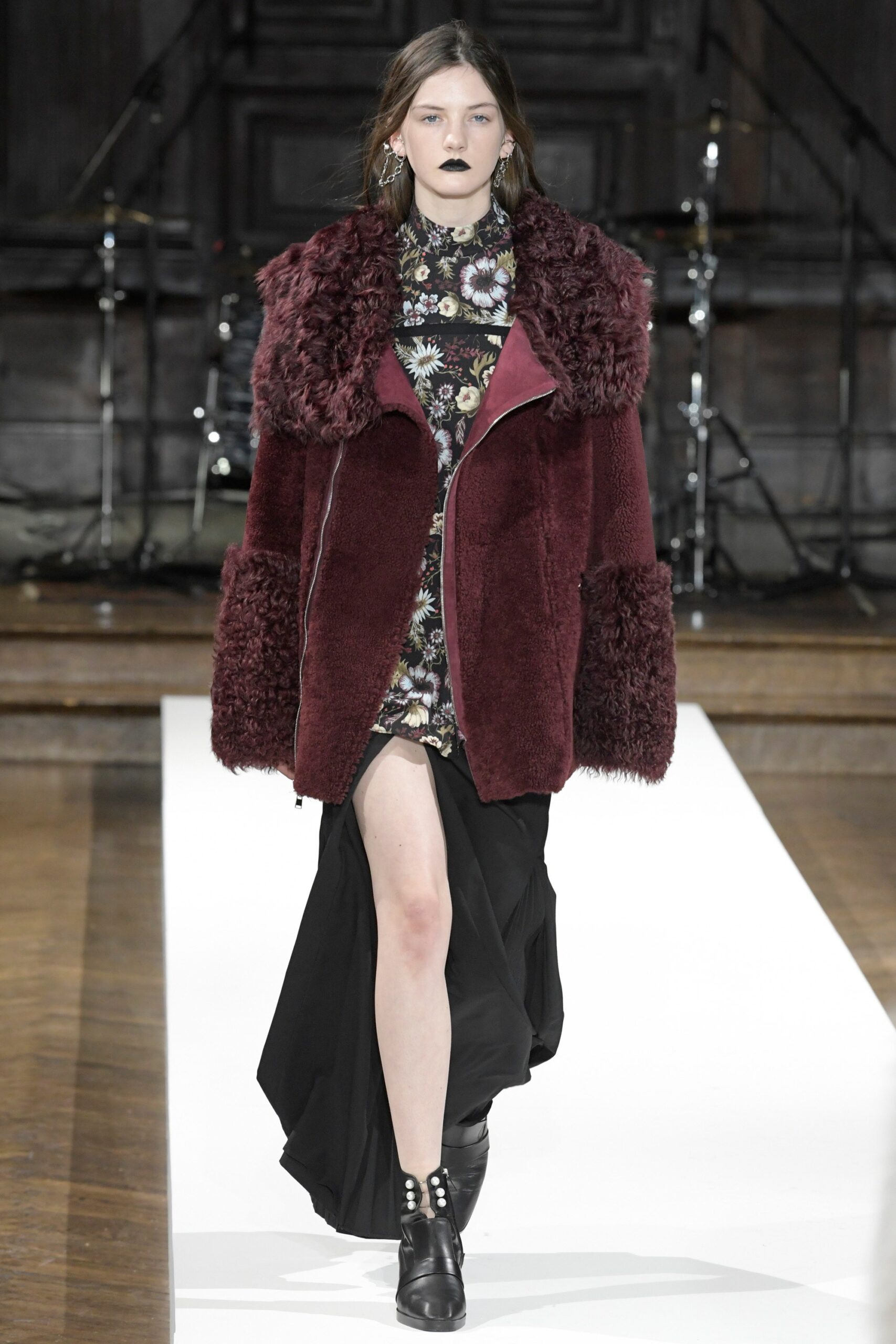maroon faux-fur coat and black dress
