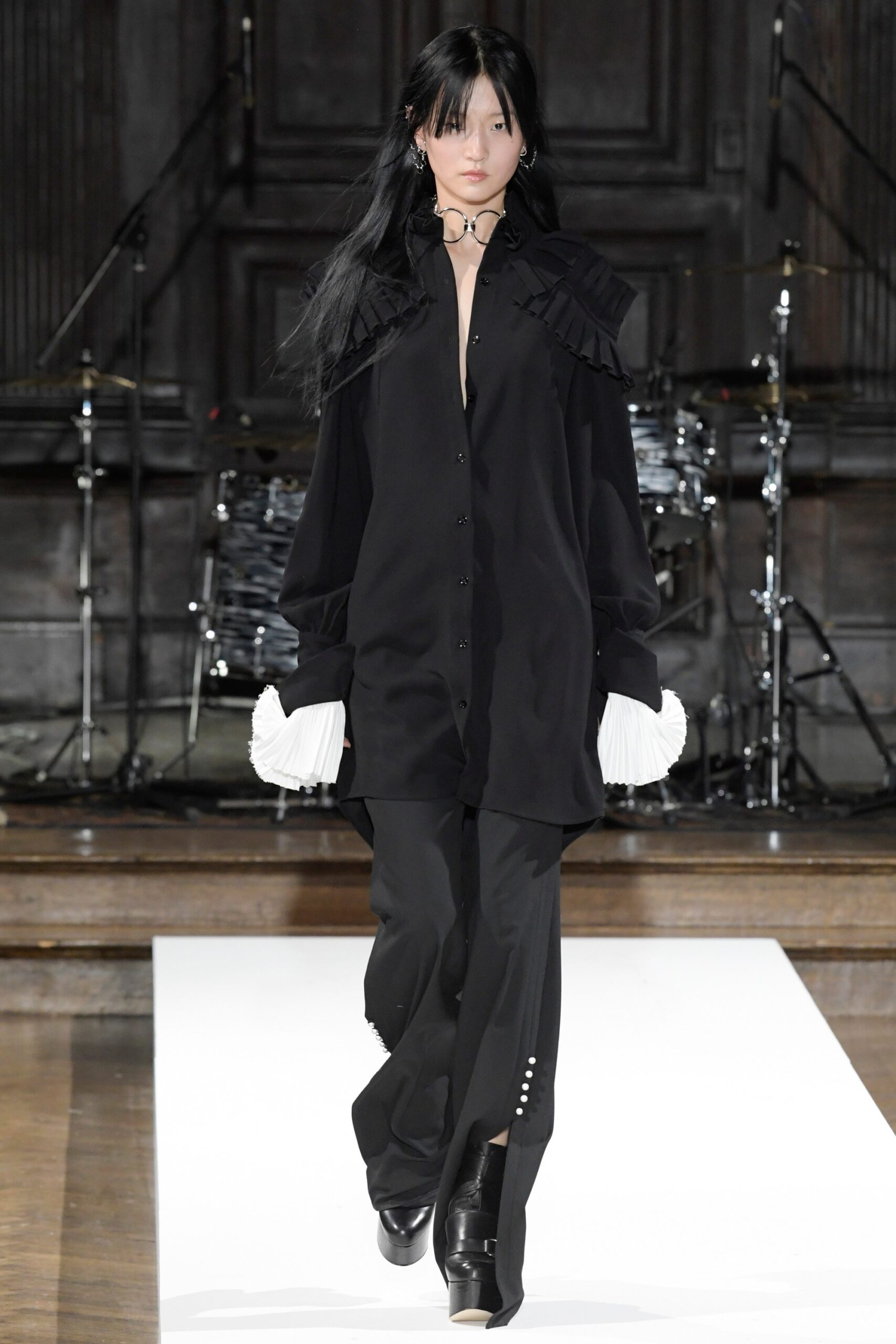 black oversized shirt and fitted pants