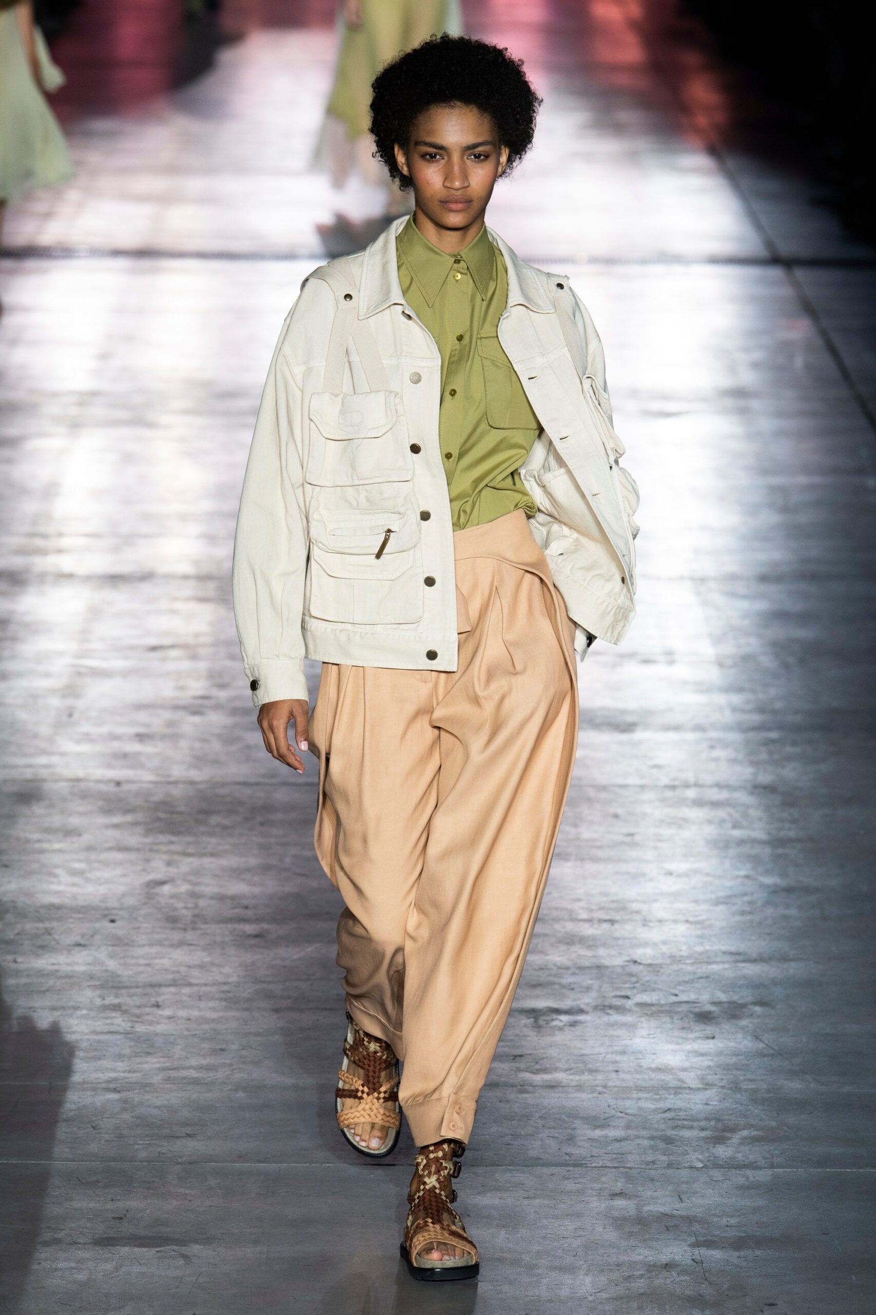 white jacket green shirt beige pants
