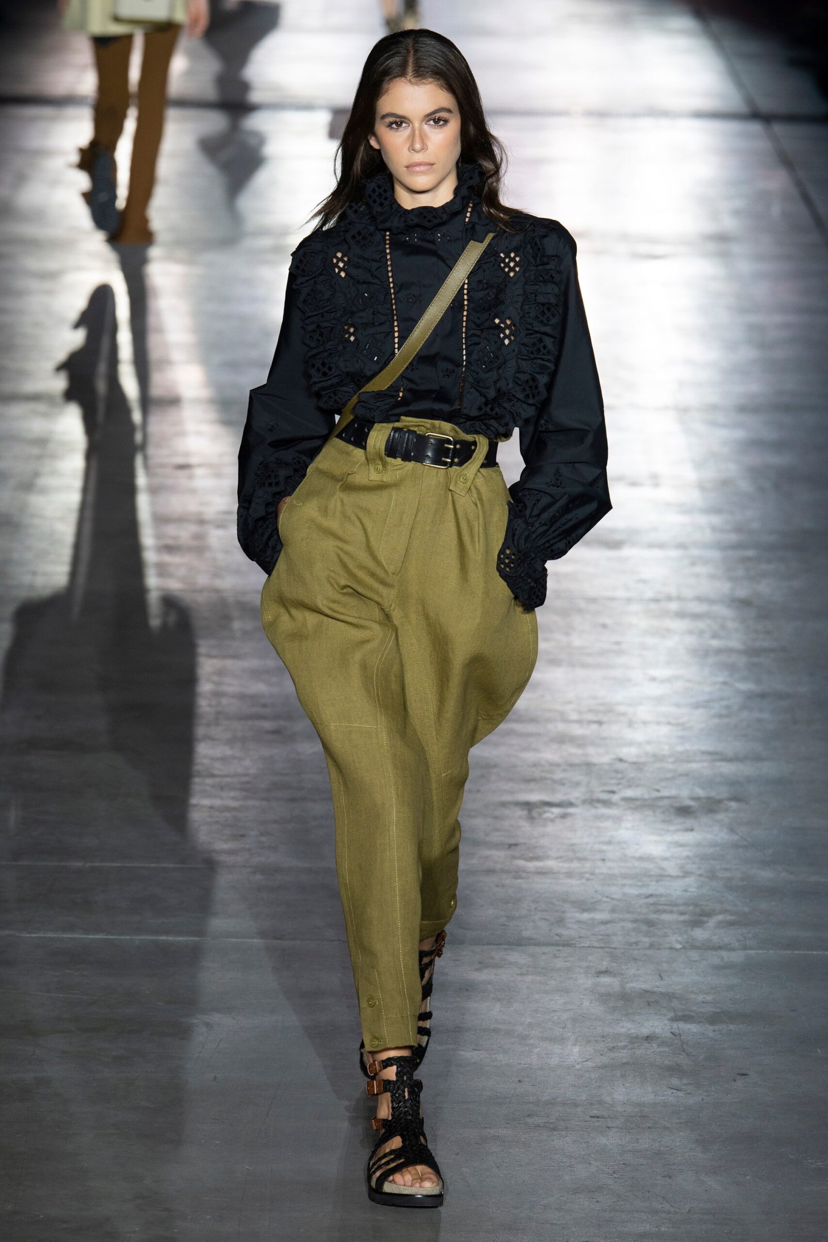 black embroidered blouse with olive pants