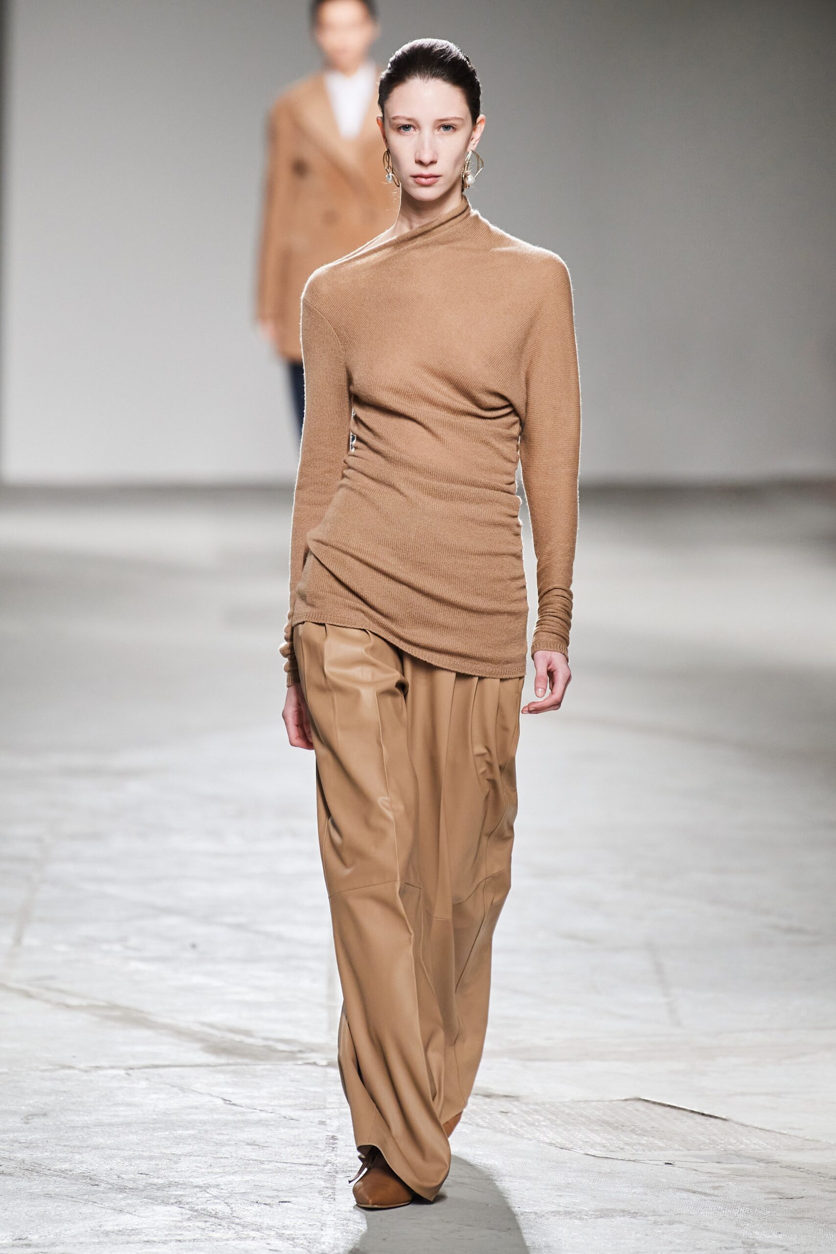 beige fitted top and tan wide-leg pants