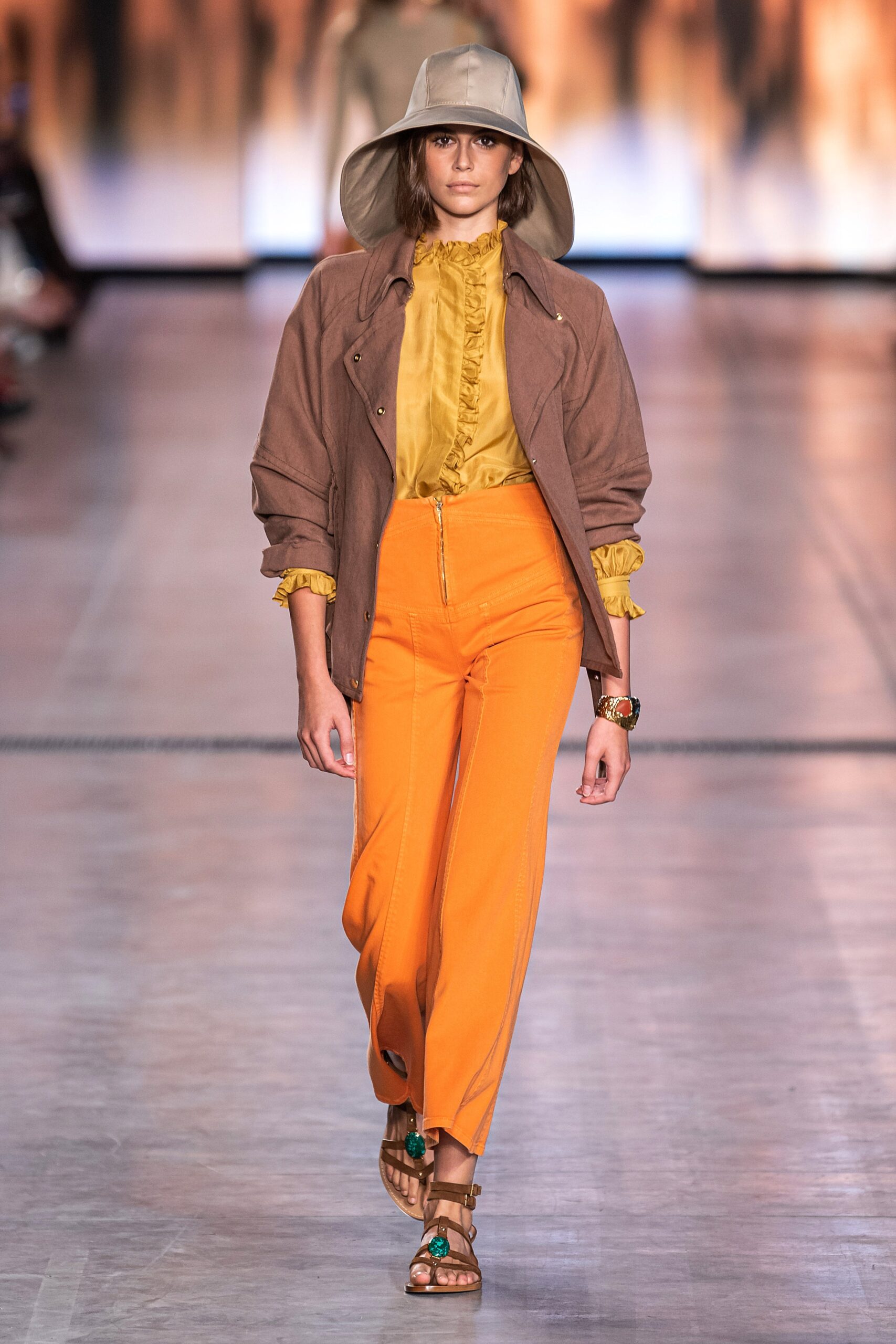 brown jacket yellow blouse orange pants
