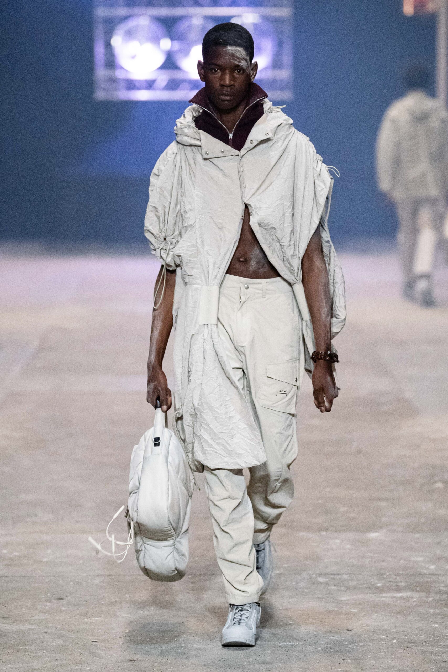 A relaxed gray jacket with long sleeves and a collared design paired with matching pants.