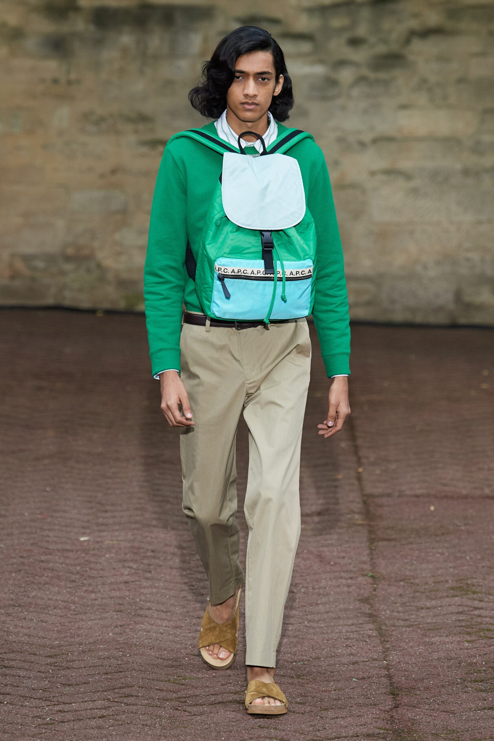 green hoodie blue vest beige pants