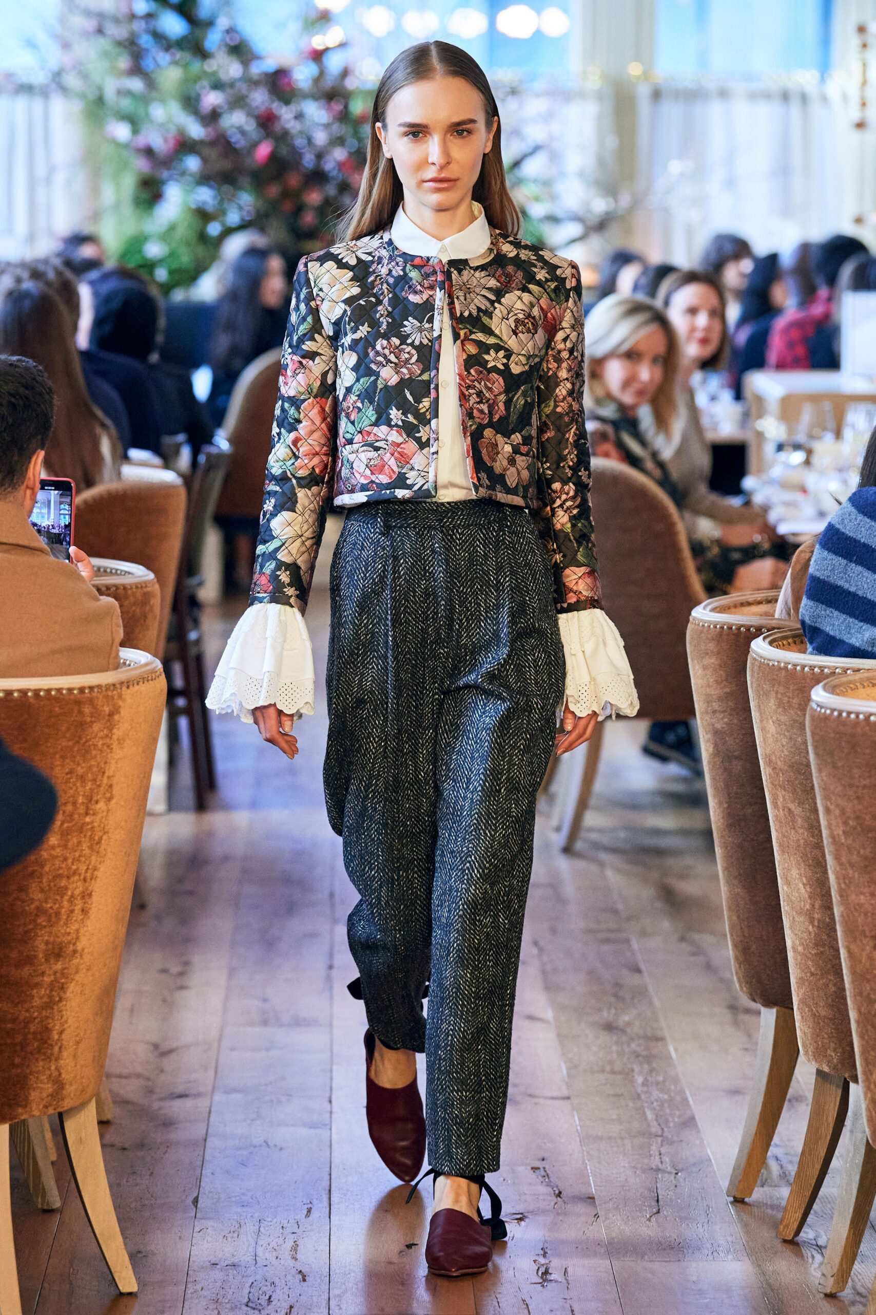 embroidered black jacket with gray pants