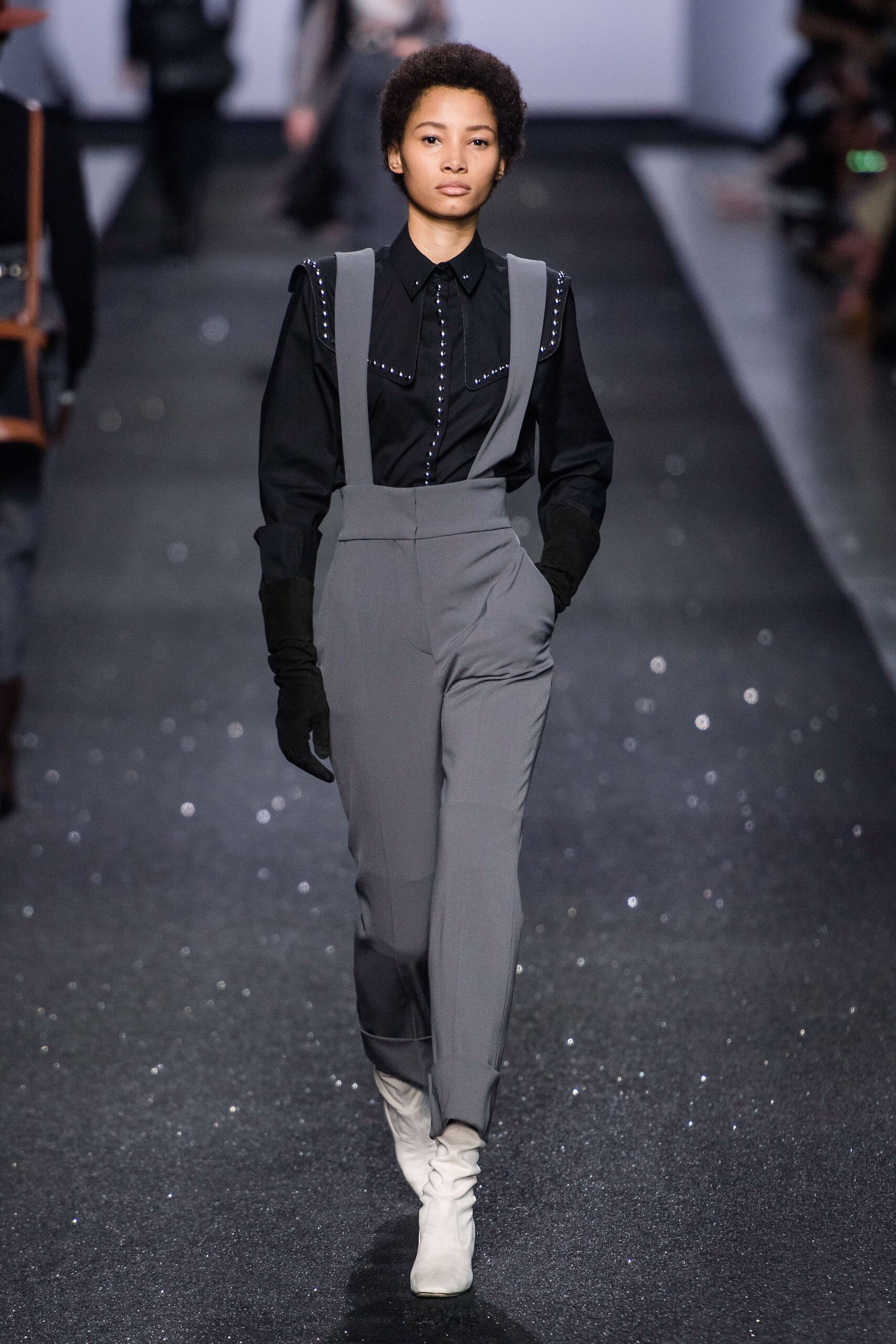 black shirt gray pants white boots