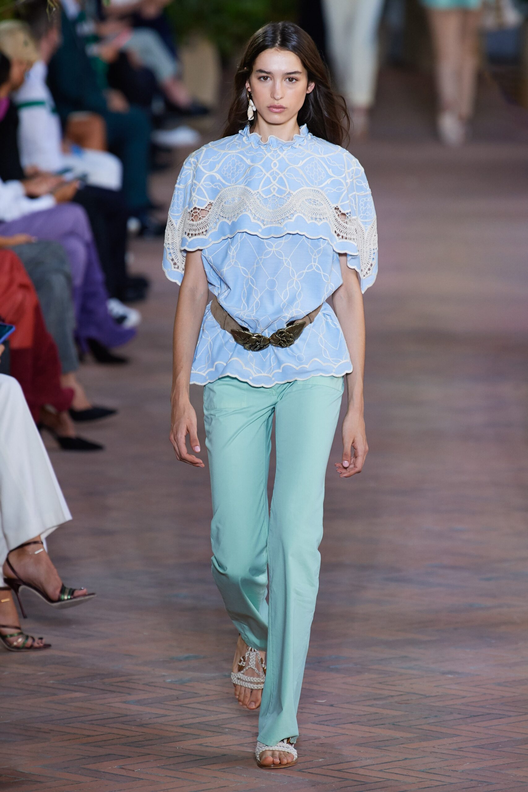 blue embroidered top with green pants