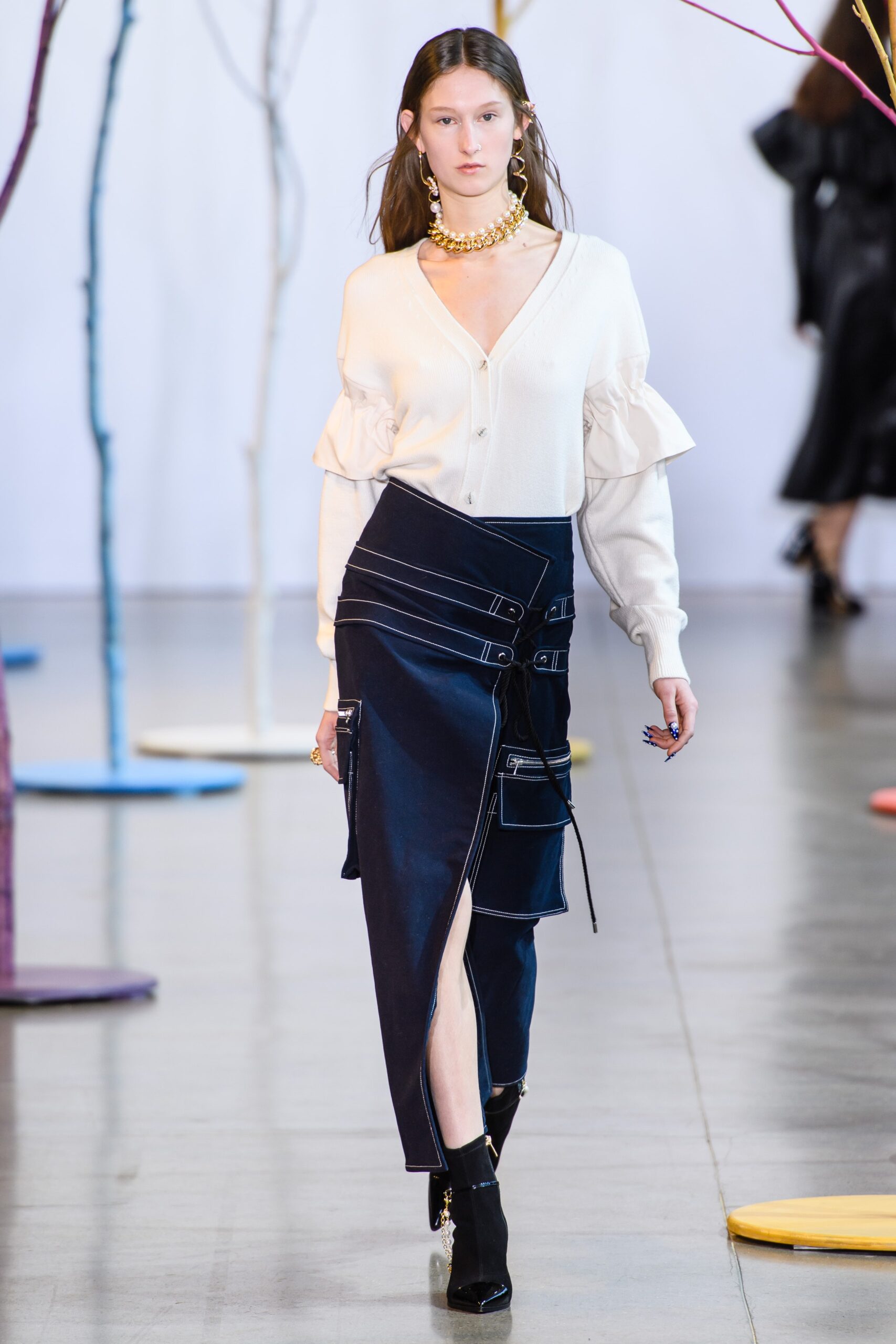 white ruffled blouse and blue denim skirt