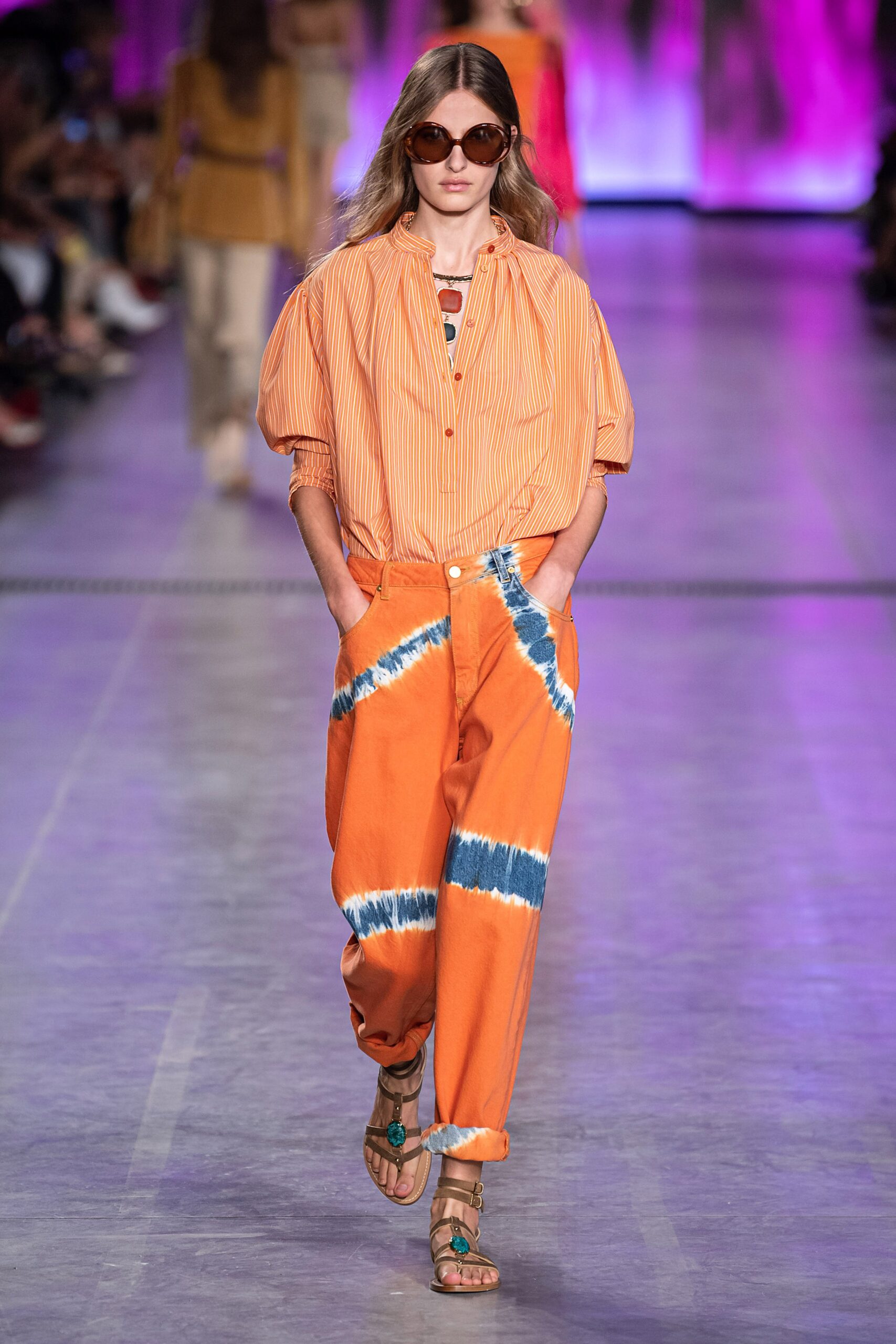 orange striped shirt and tie-dye pants