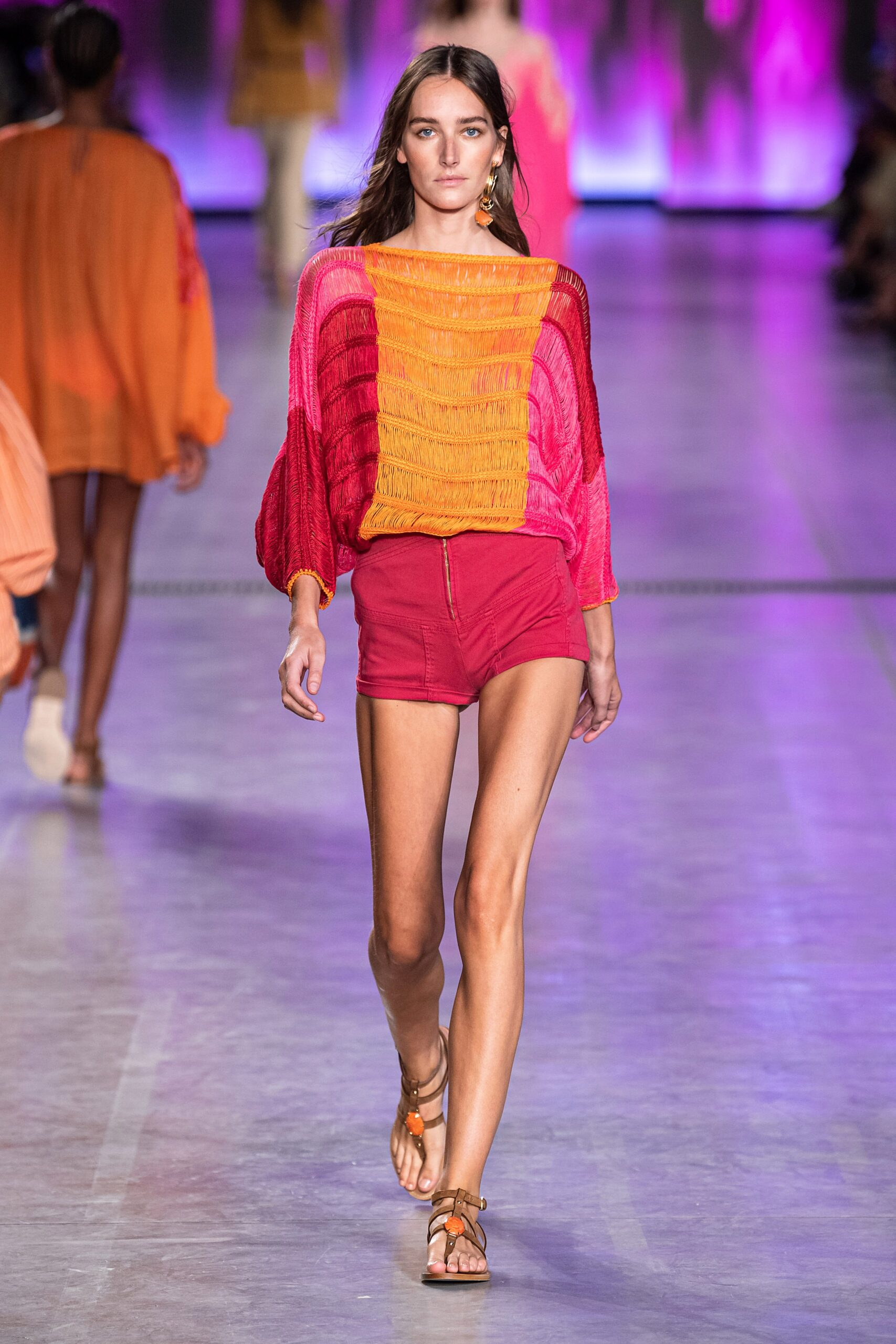 fringed colorful top with red shorts