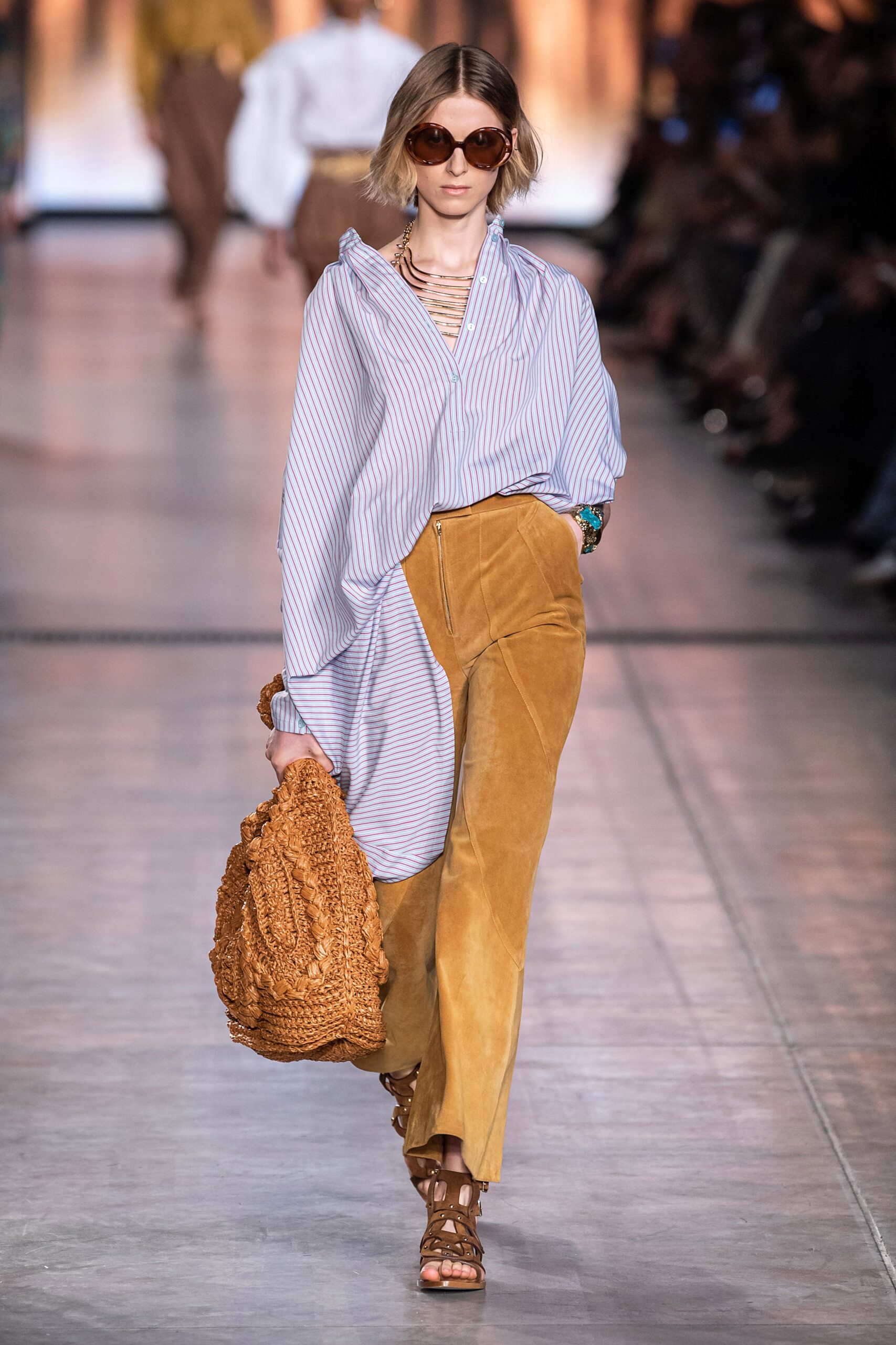 blue and white striped shirt with brown pants