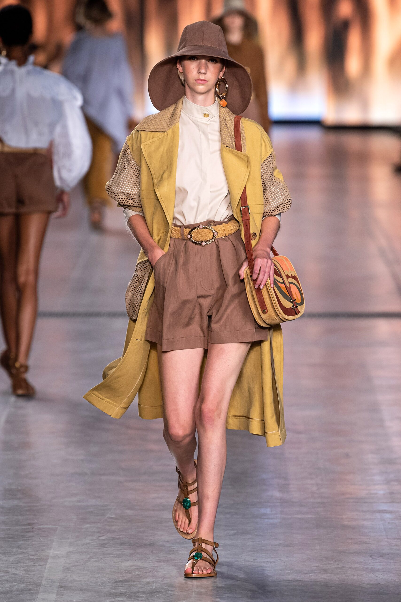 yellow coat with brown shorts
