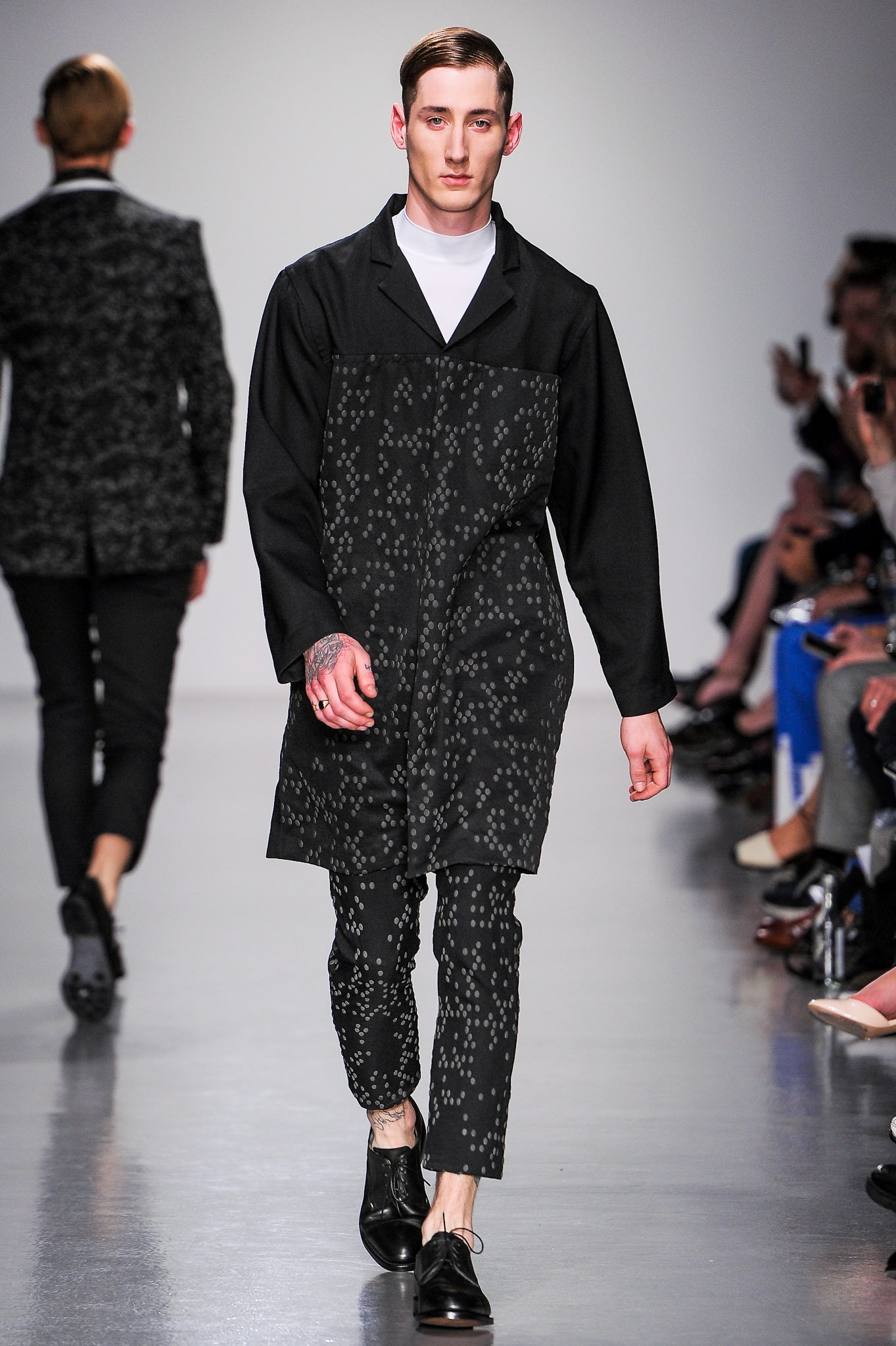 black cotton long-sleeve collared relaxed buttoned coat