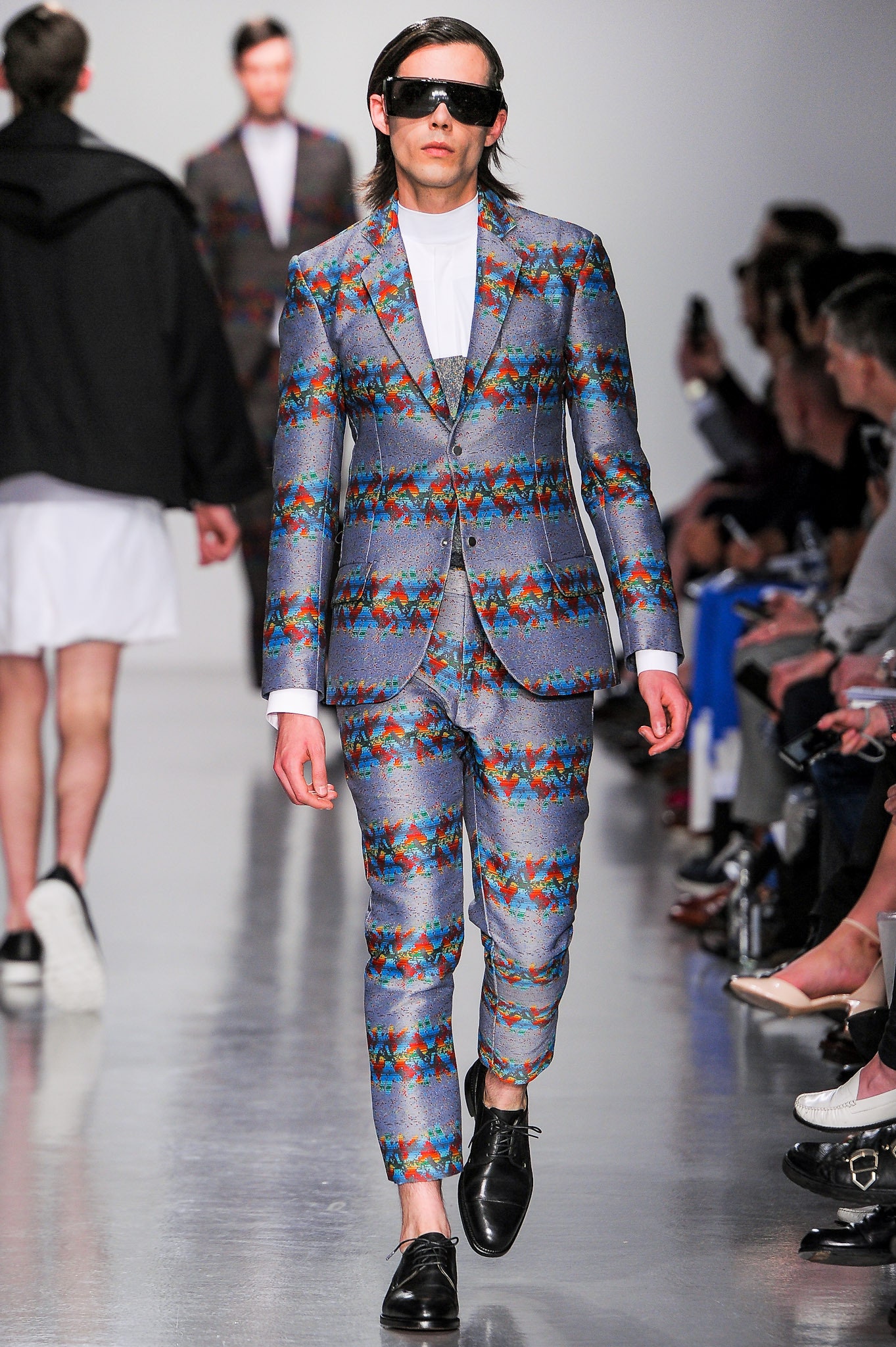 colorful tailored suit with sunglasses