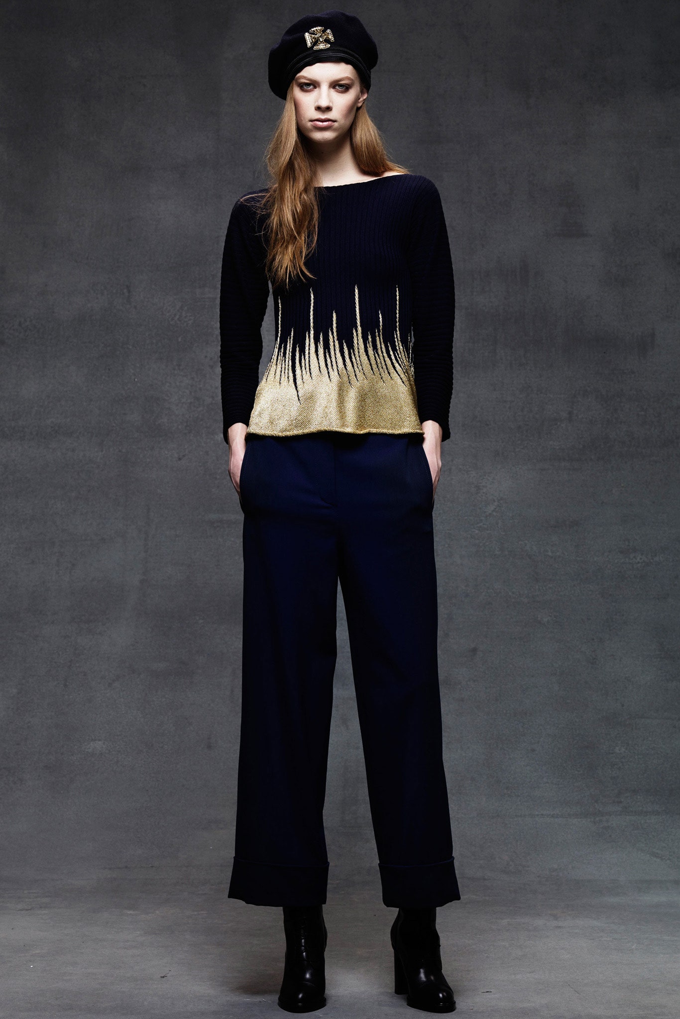 black and gold fitted top with wide-leg pants