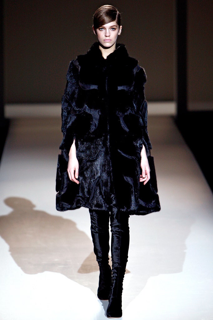 black fur coat with fitted pants