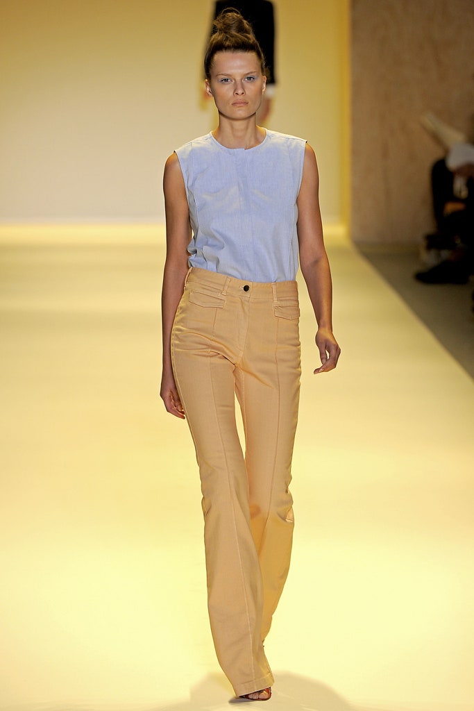 blue sleeveless top and yellow flared pants