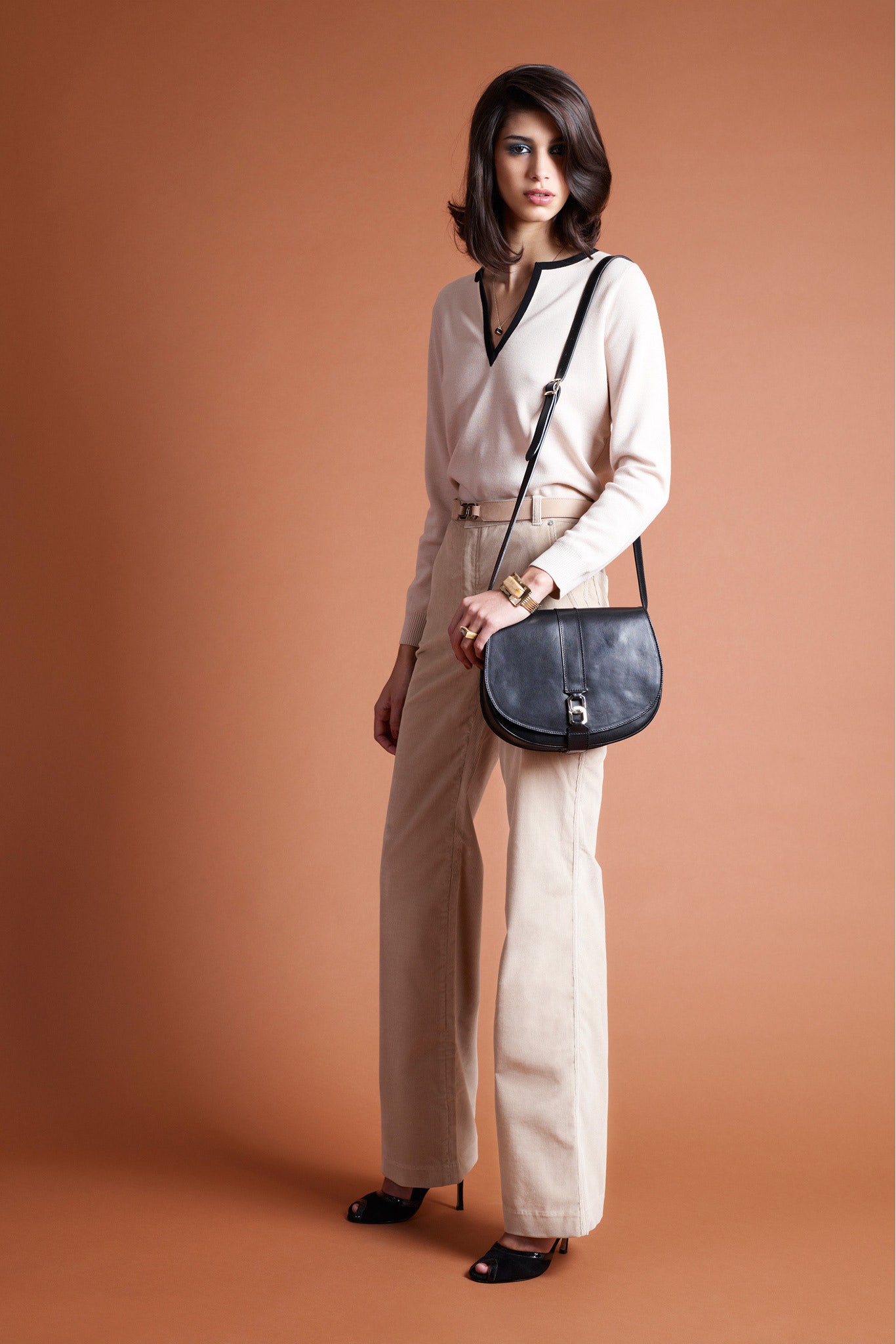 beige silk blouse with cream pants