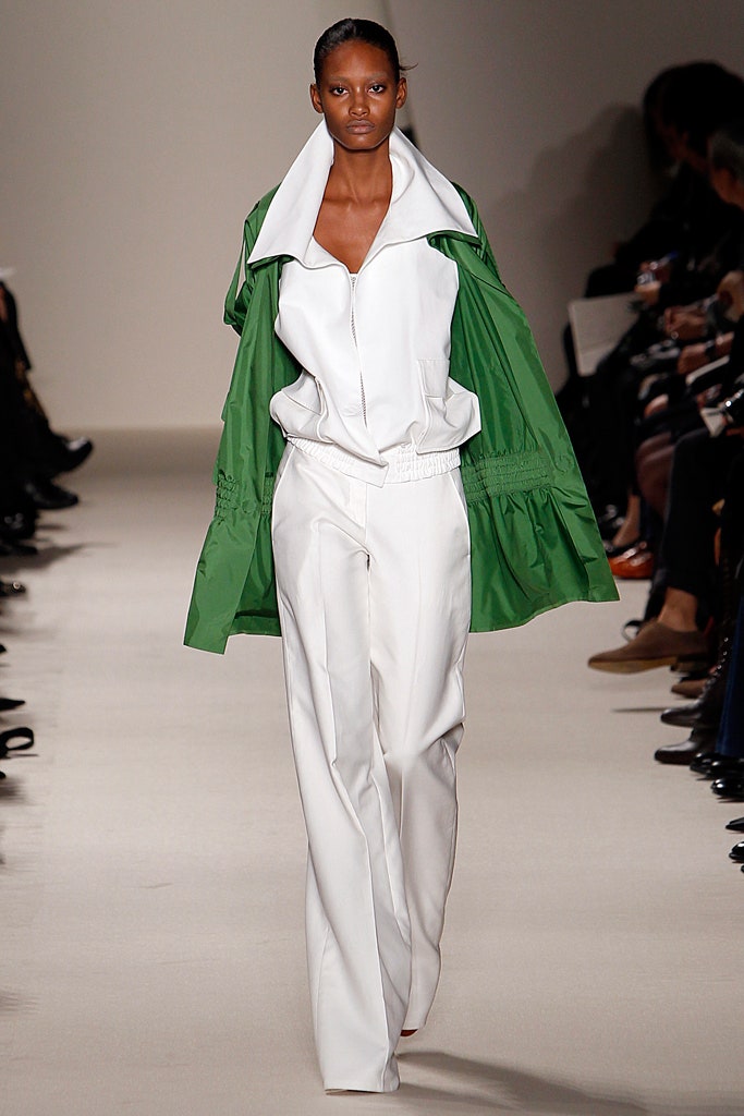 green jacket and white tailored pants