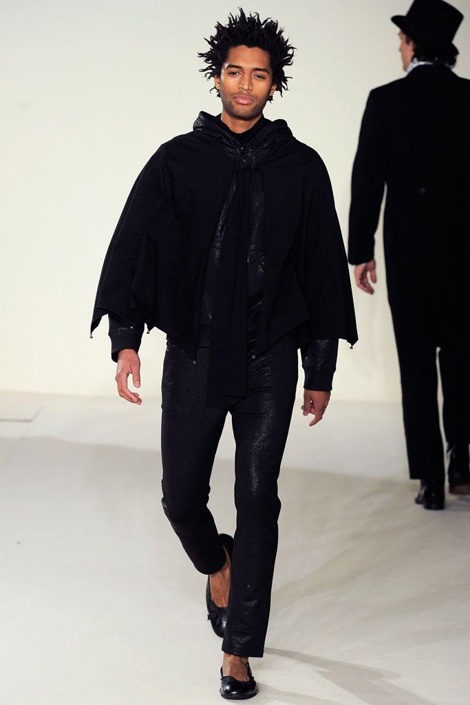 black wool cape with fitted shirt