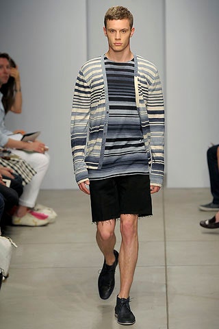 blue striped cardigan and black shorts