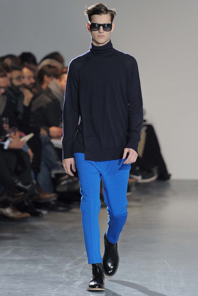 black wool turtleneck sweater with blue pants