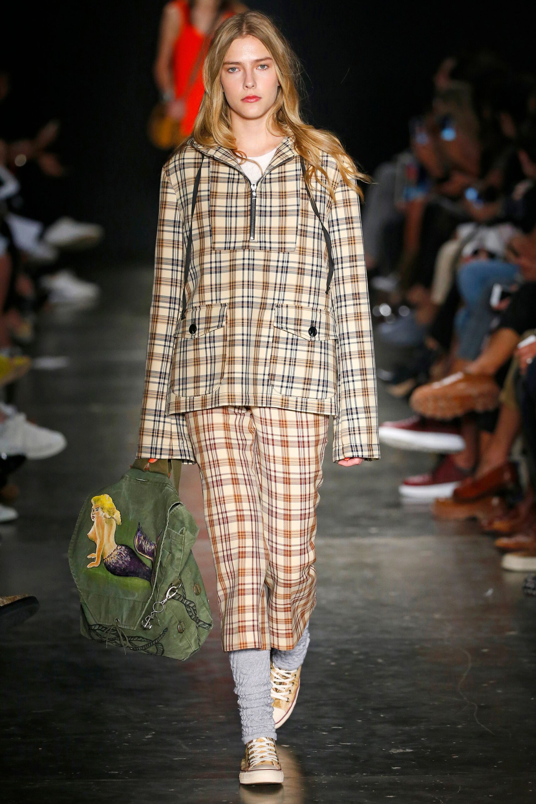 A relaxed-fit beige checked jacket paired with matching plaid pants.