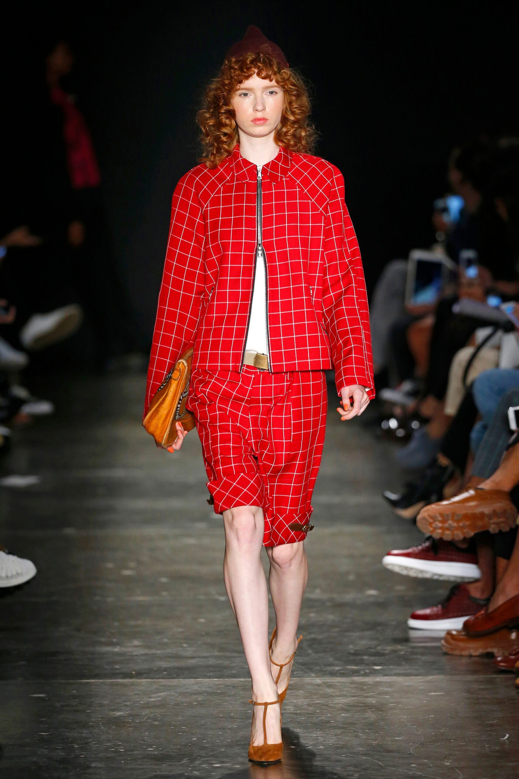 A fitted red checked jacket paired with matching shorts, creating a bold and stylish look.