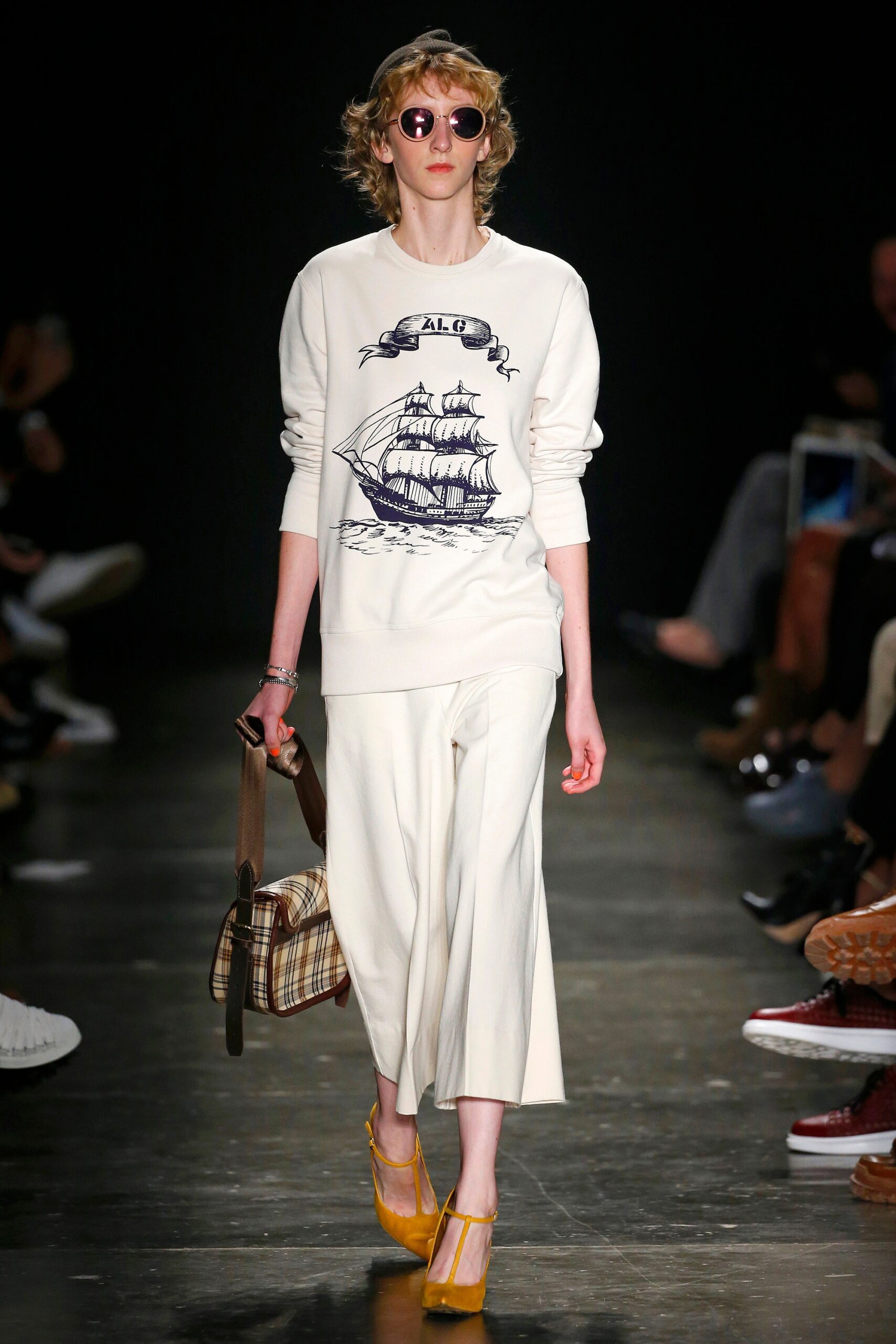 A relaxed white printed sweater paired with matching culottes for a stylish look.