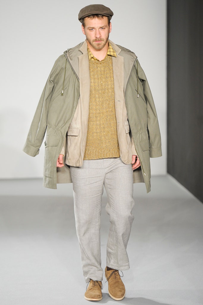 gray jacket yellow sweater beige pants