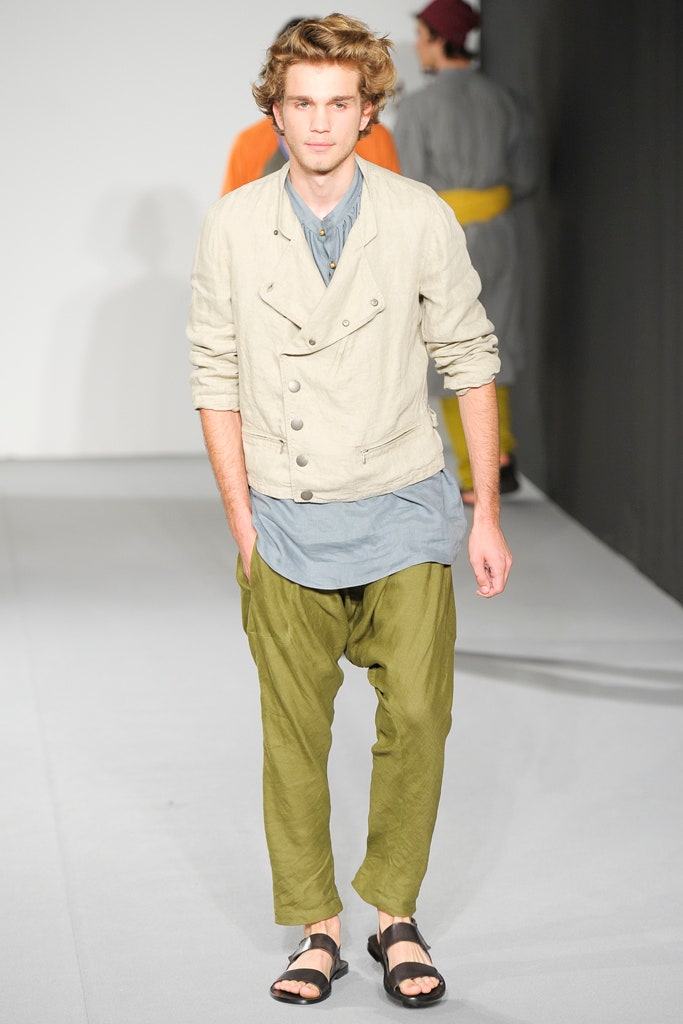 beige jacket with blue shirt and green pants