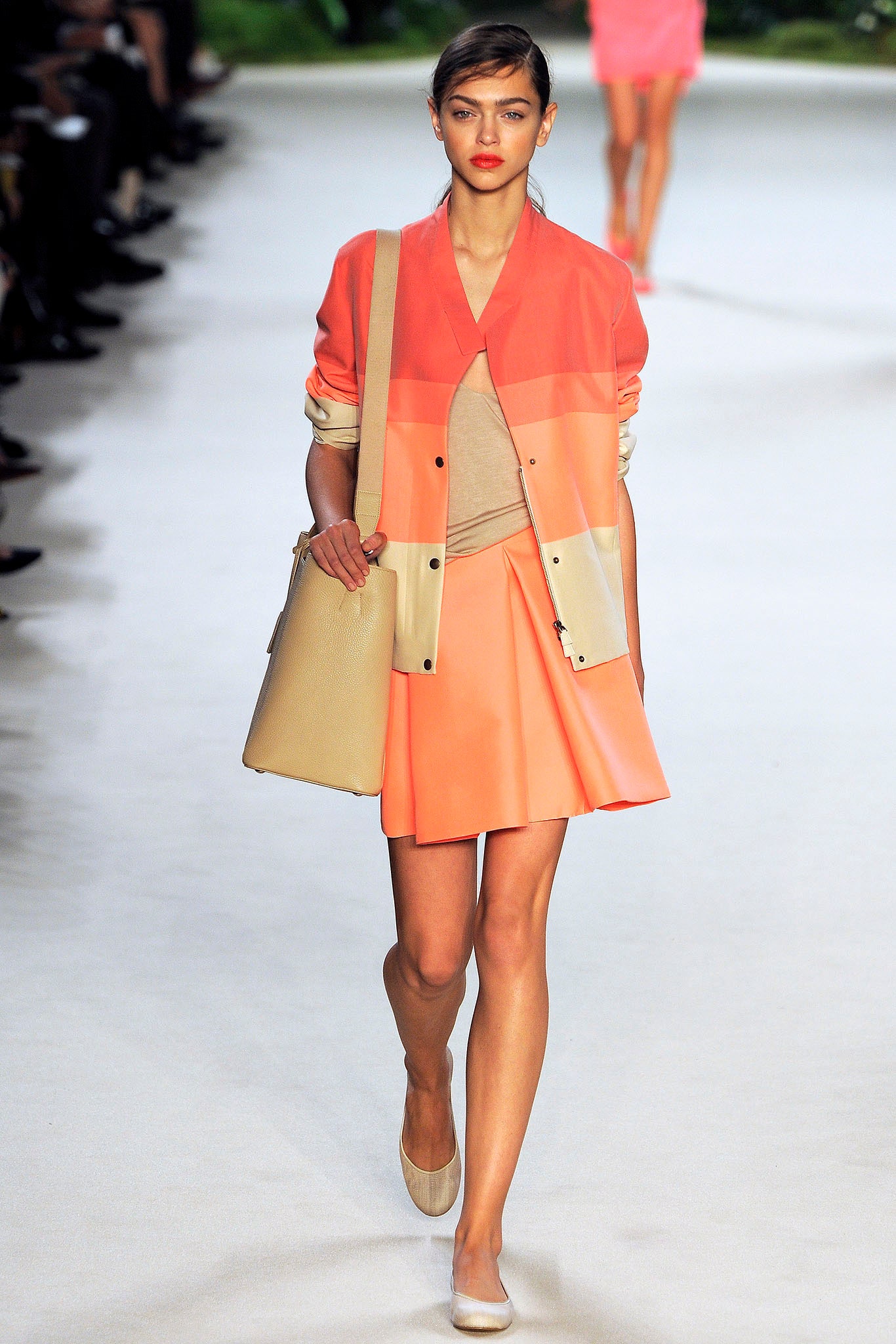 color-blocked orange jacket and beige top