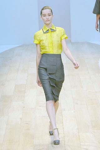 yellow collared shirt and gray skirt