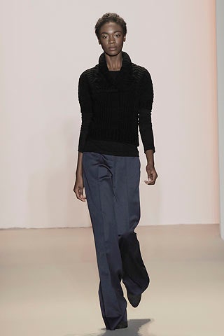 black fitted sweater and blue pants