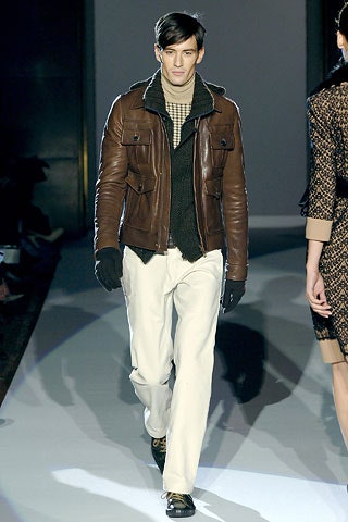 brown leather jacket with black sweater