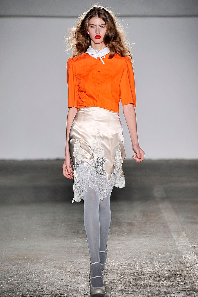 orange fitted blouse with white skirt