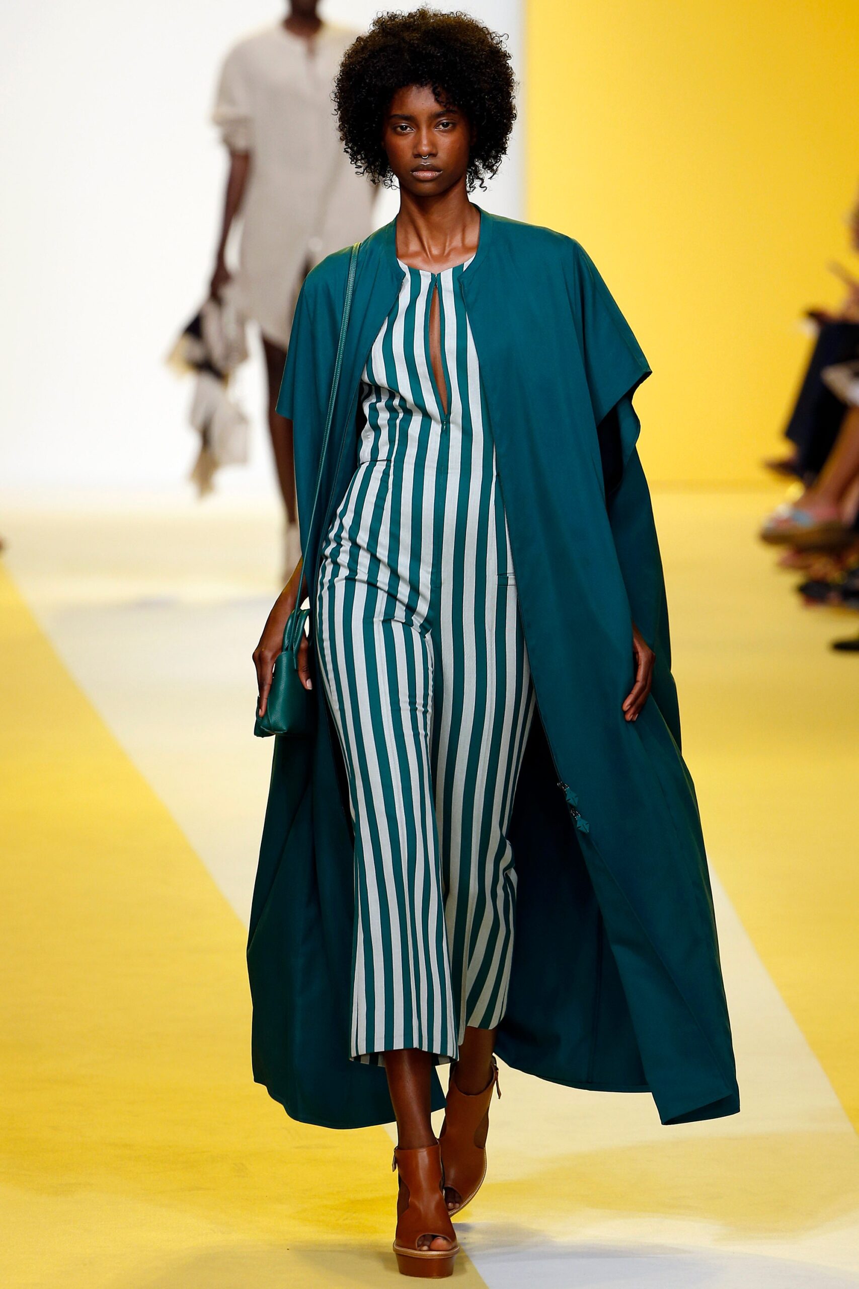 green and white striped jumpsuit with teal cape