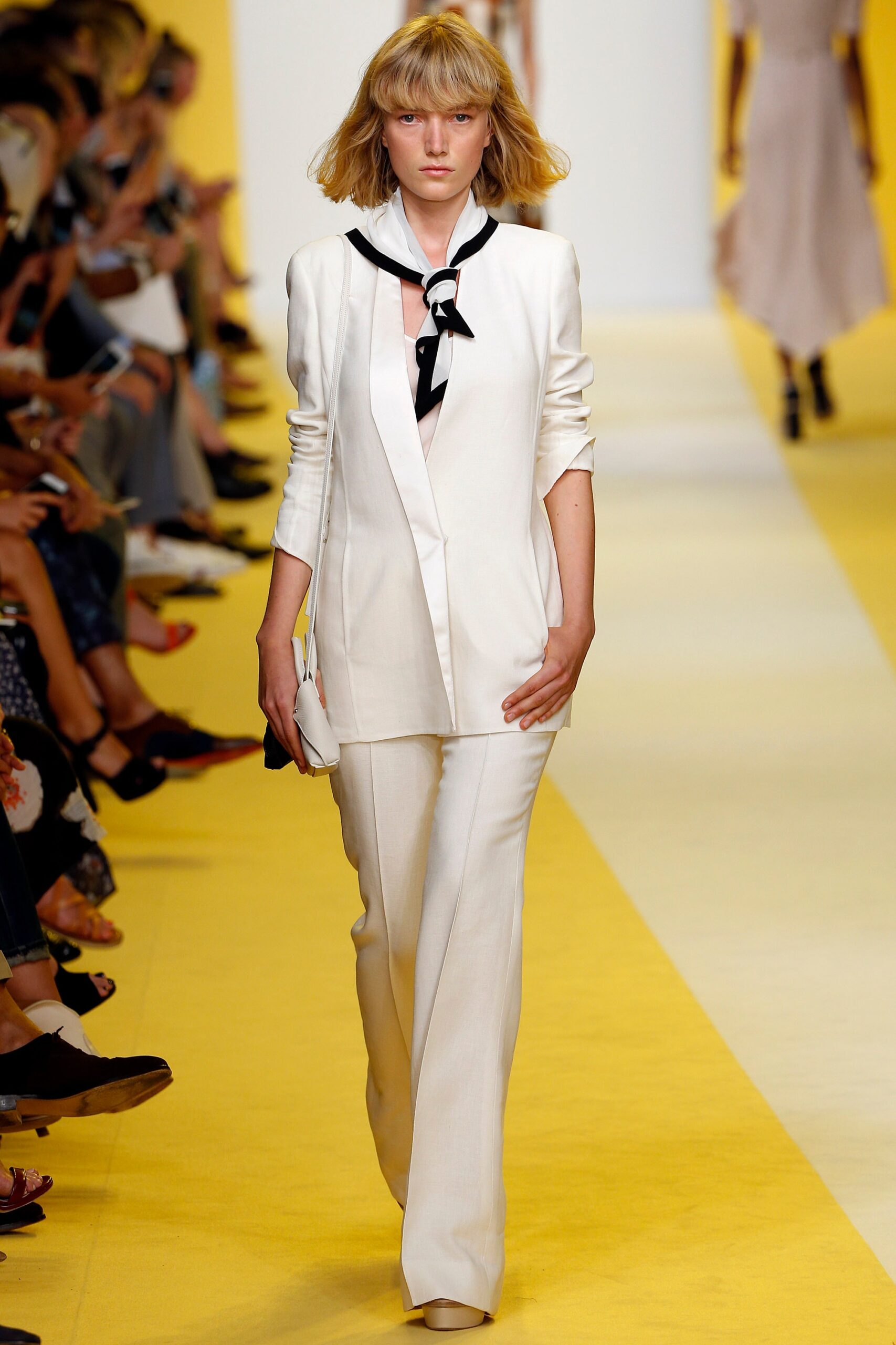 white tailored suit with black blouse