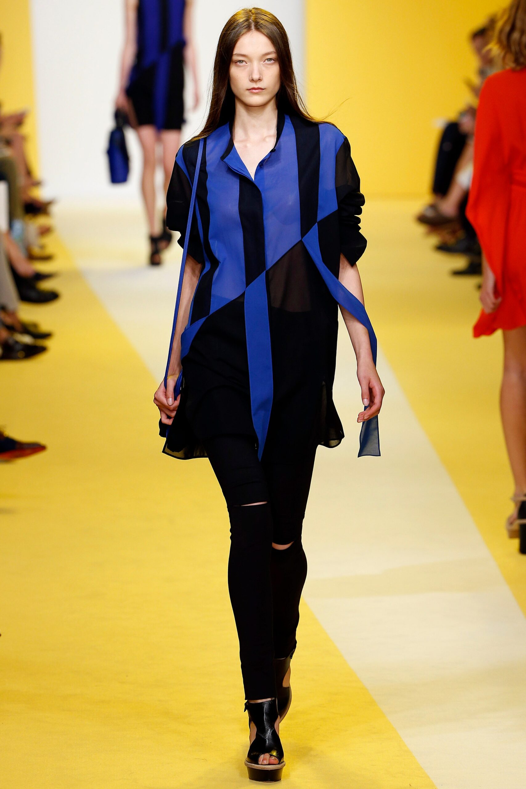 blue sheer asymmetric shirt with black pants