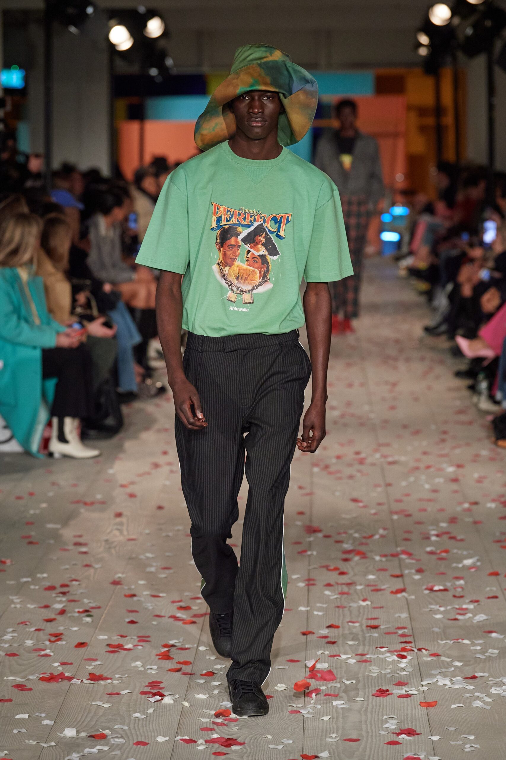 green printed t-shirt with striped pants