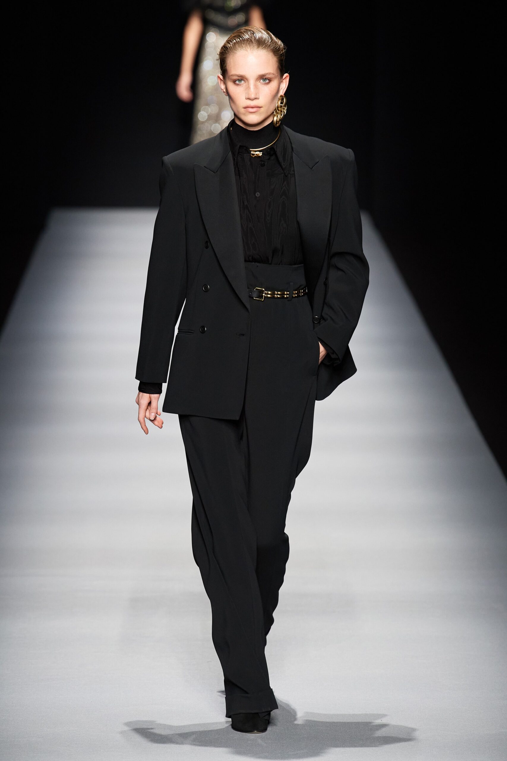 black wool long-sleeve collared tailored buttoned pockets suit