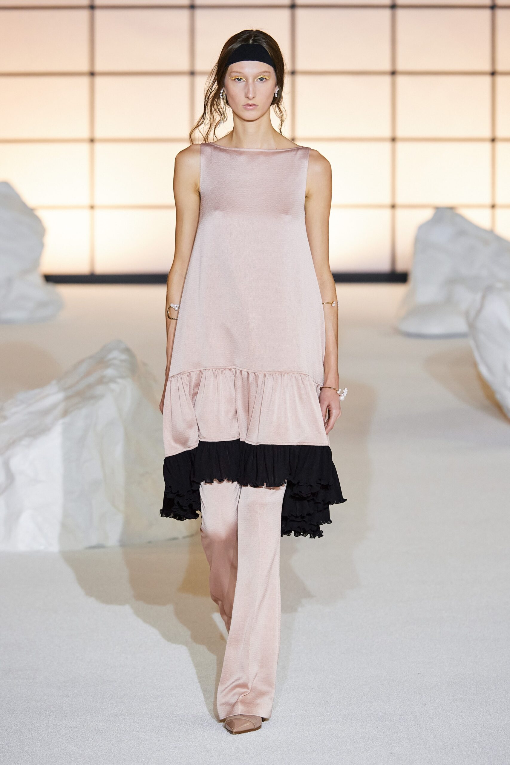 pink tiered midi dress with beige pants