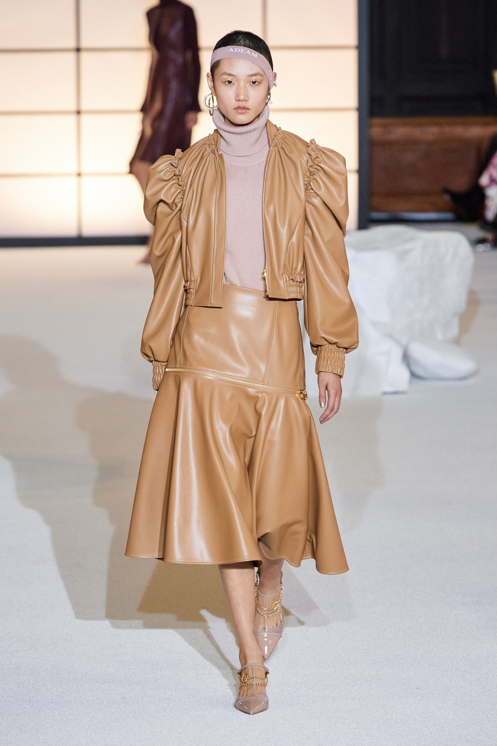 brown leather jacket and skirt