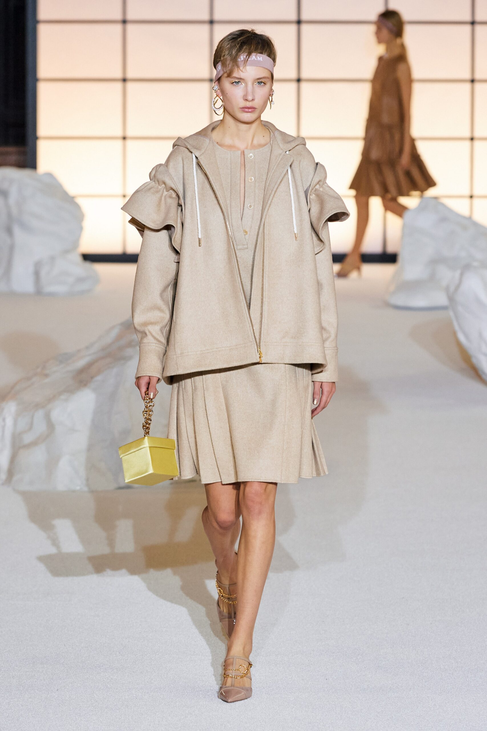 beige relaxed hoodie and pleated skirt