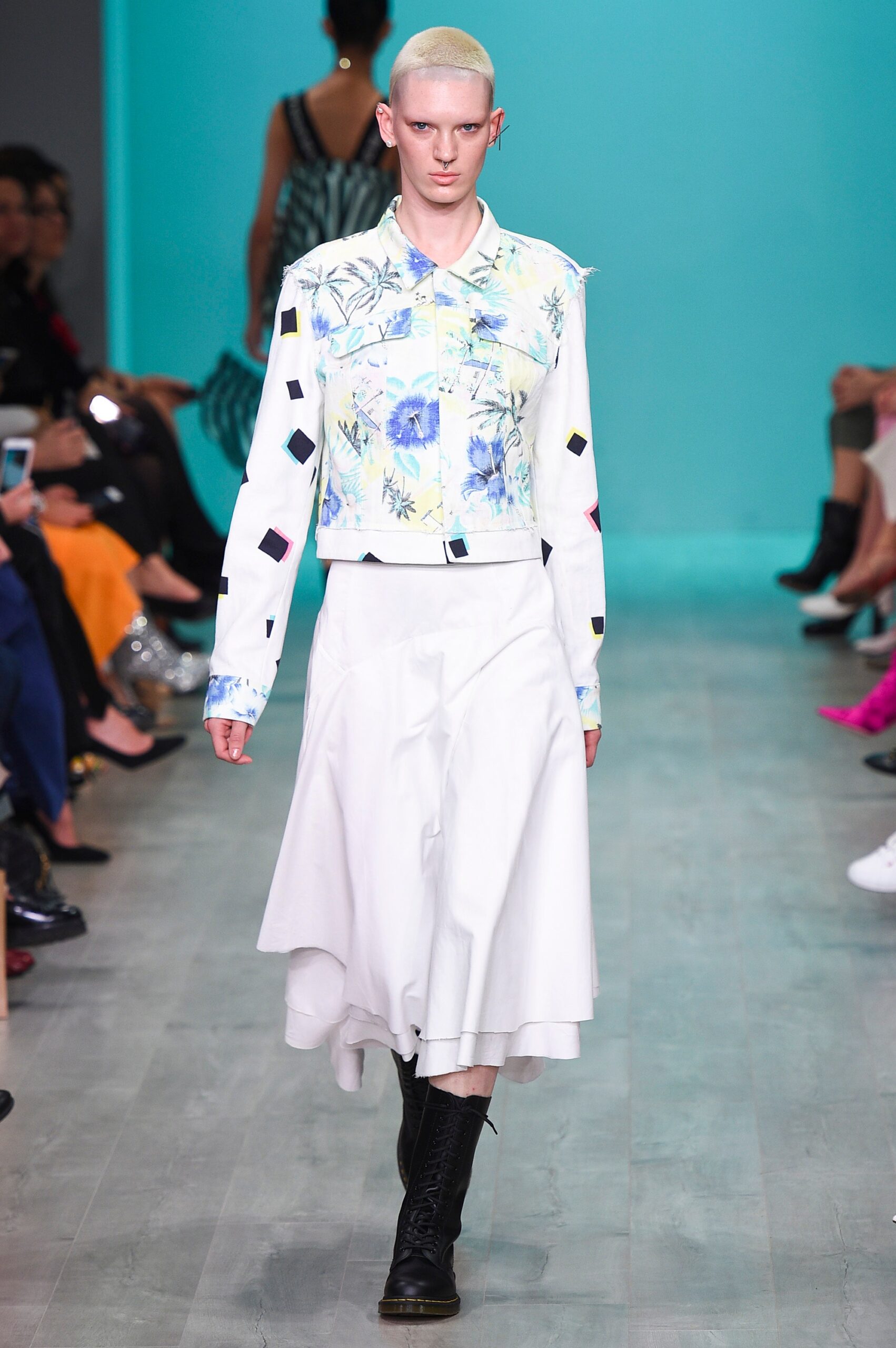 white embroidered jacket and midi skirt