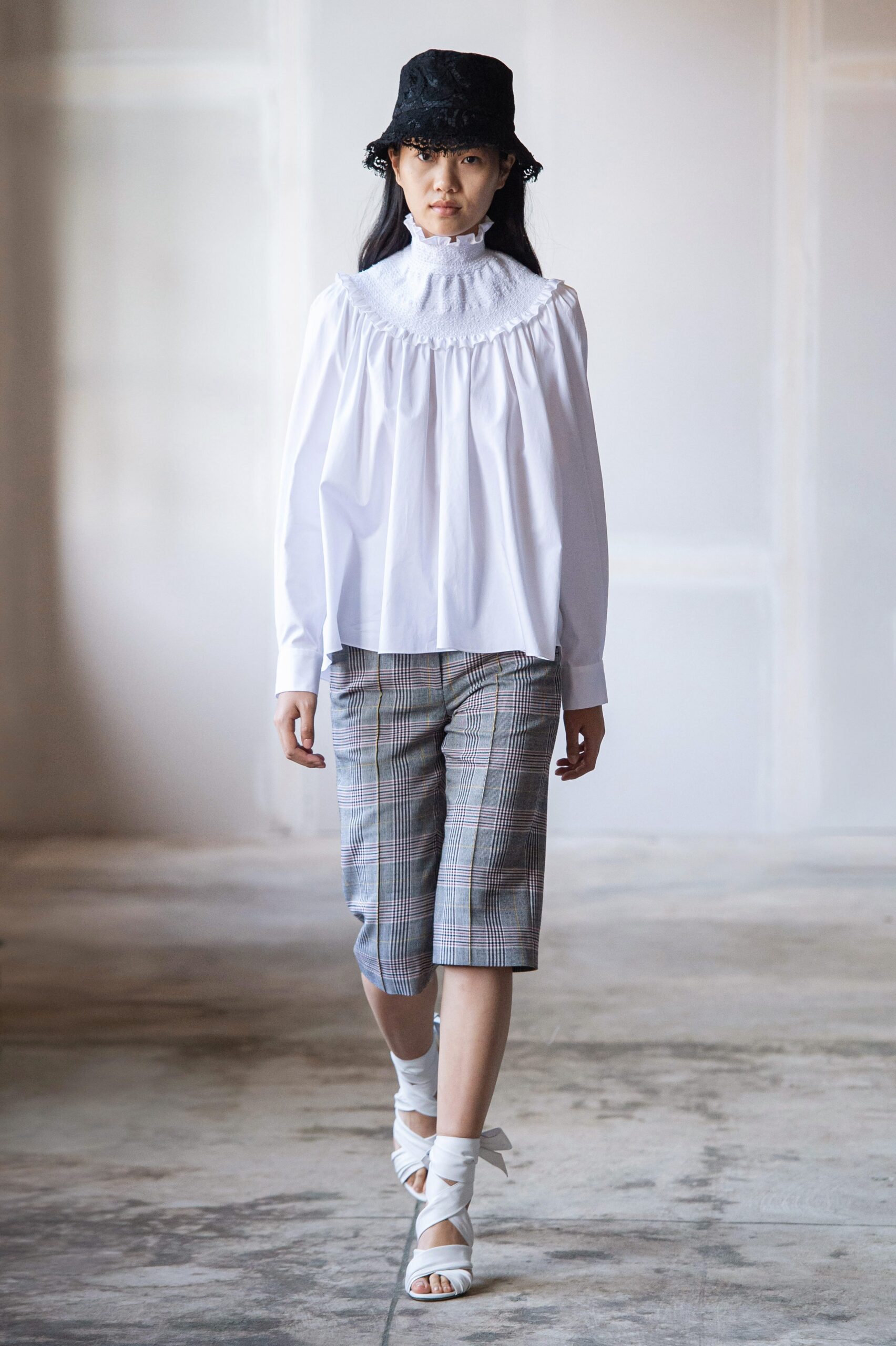 white relaxed blouse with gray shorts